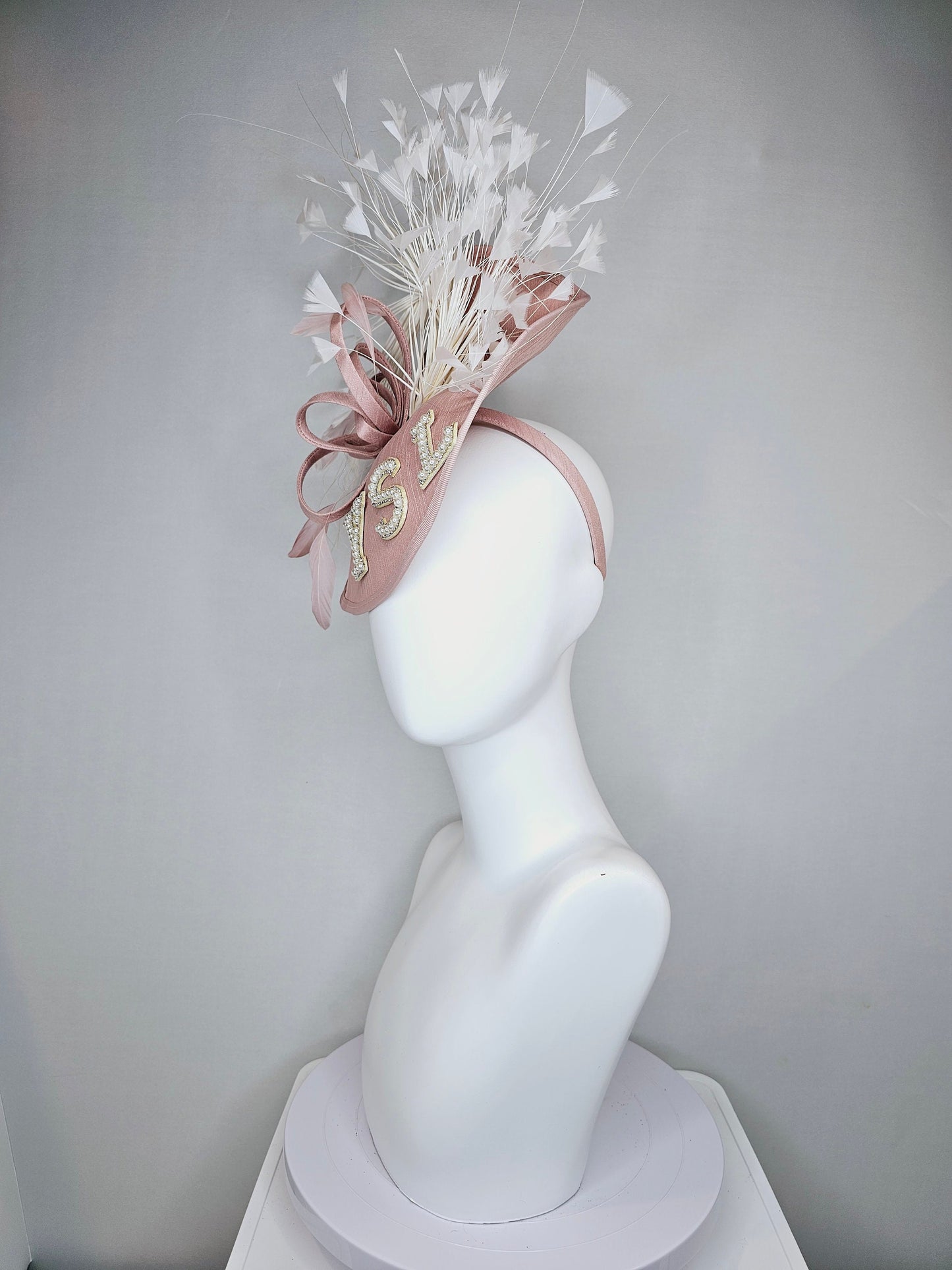 kentucky derby hat fascinator dusty rose blush silk like saucer with white feathers and beaded pearl letters