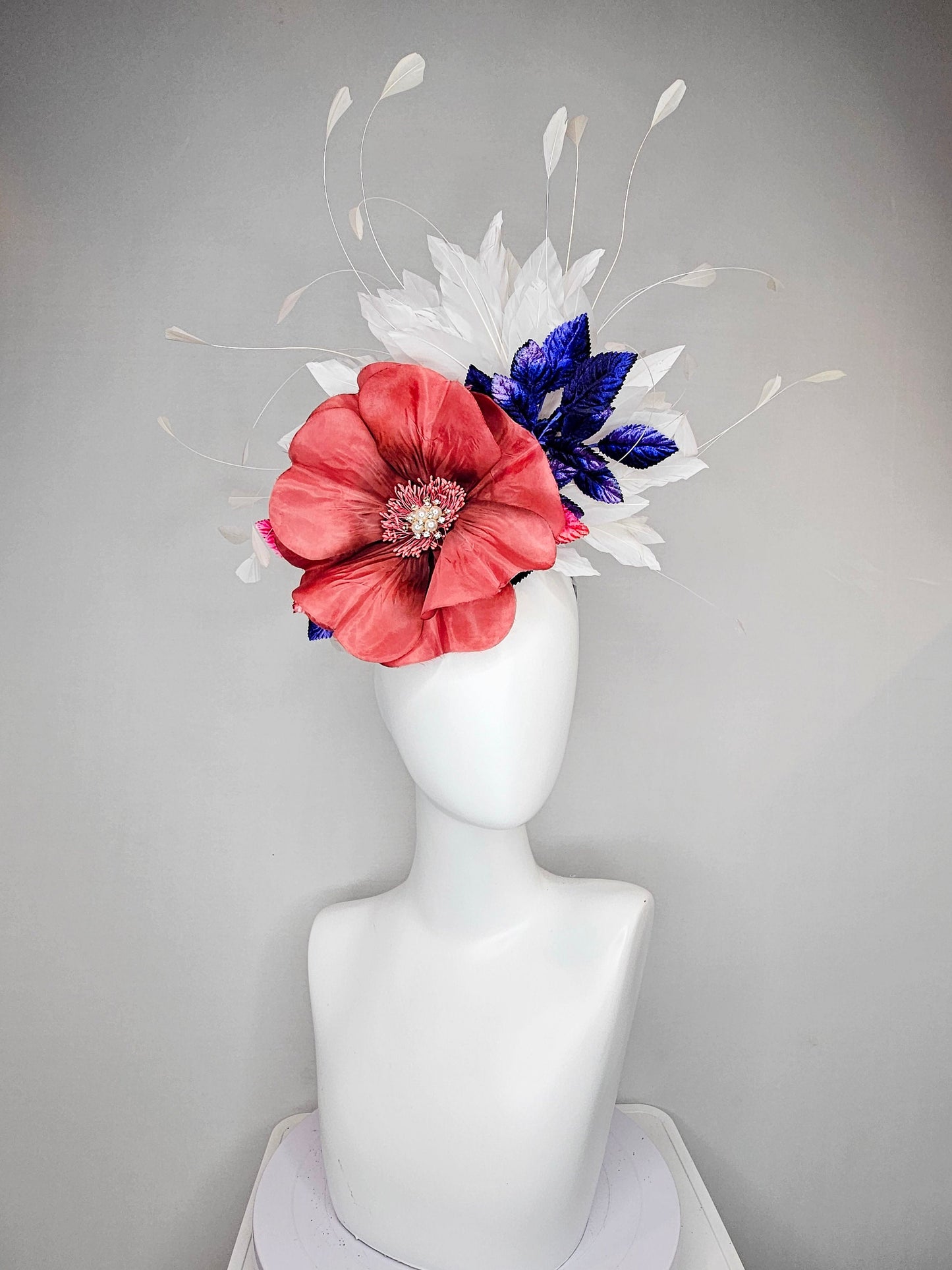 kentucky derby hat fascinator hat coral sinamay base large coral burnt orange flower with white feathers purple royal blue pink leaves