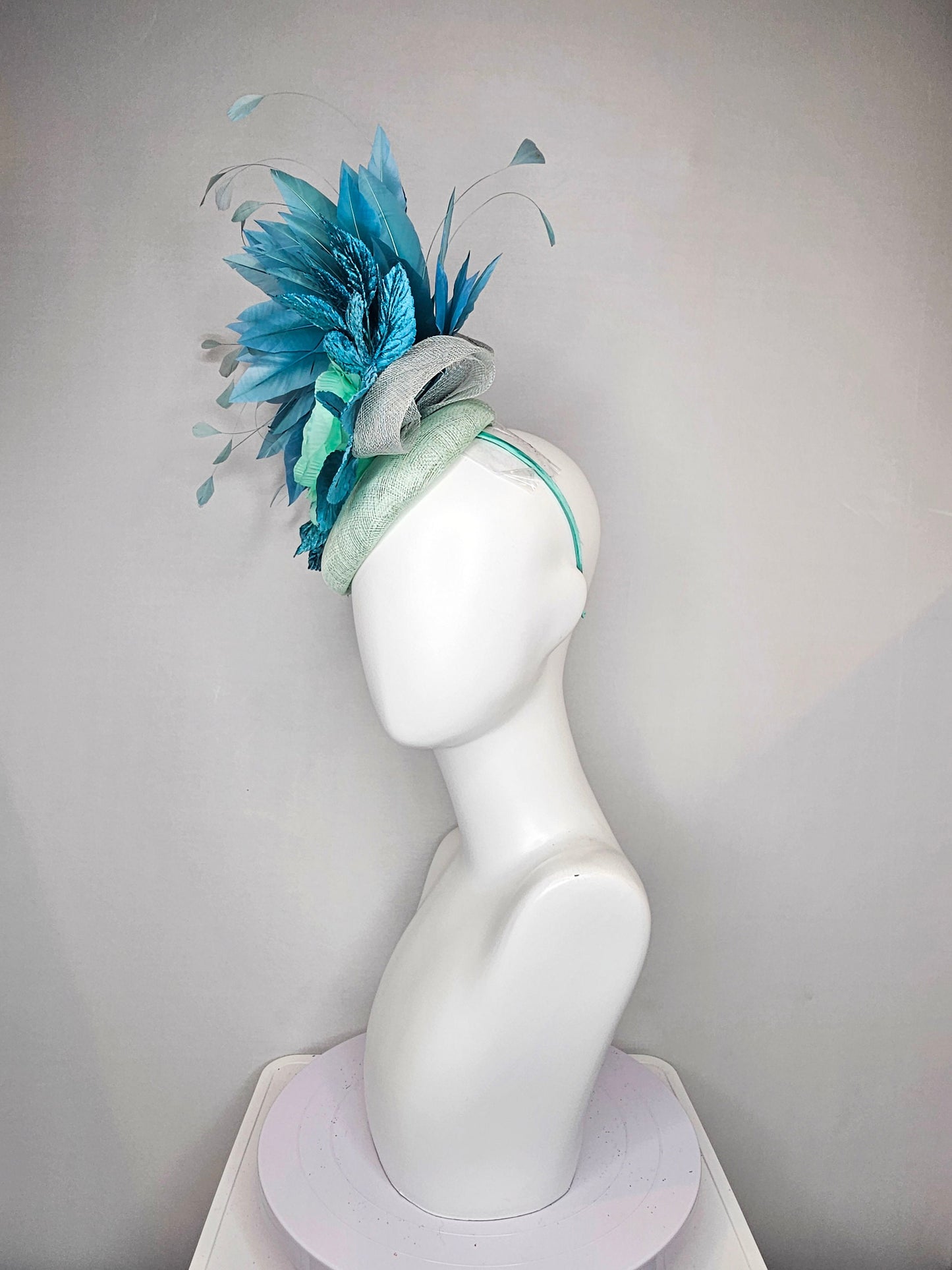 kentucky derby hat fascinator light ice blue green sinamay with mint green silk flower teal leaves teal green blue feathers