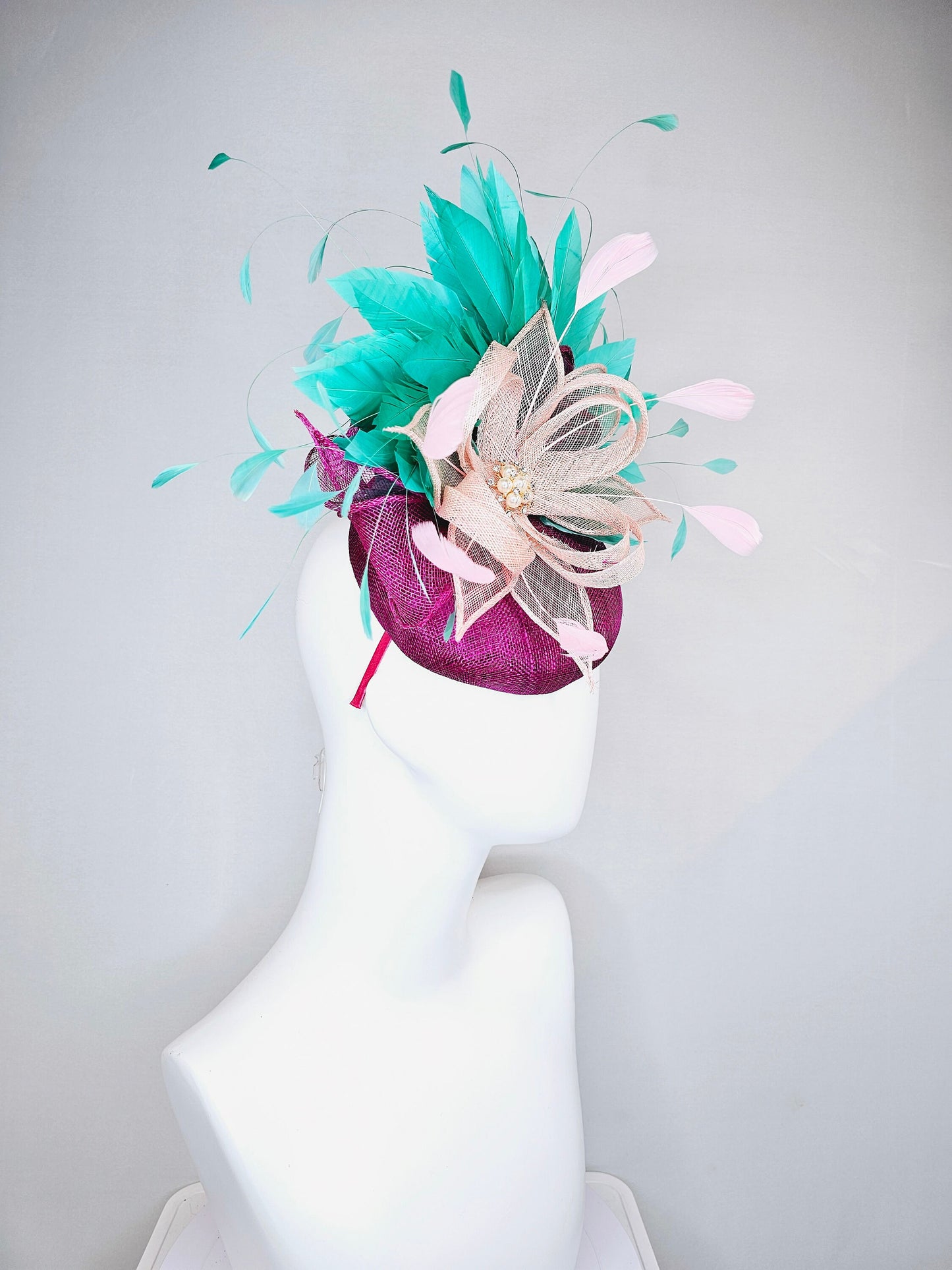 kentucky derby hat fascinator purple magenta sinmaay blush pink sinamay flower with pearls and bright green feathers