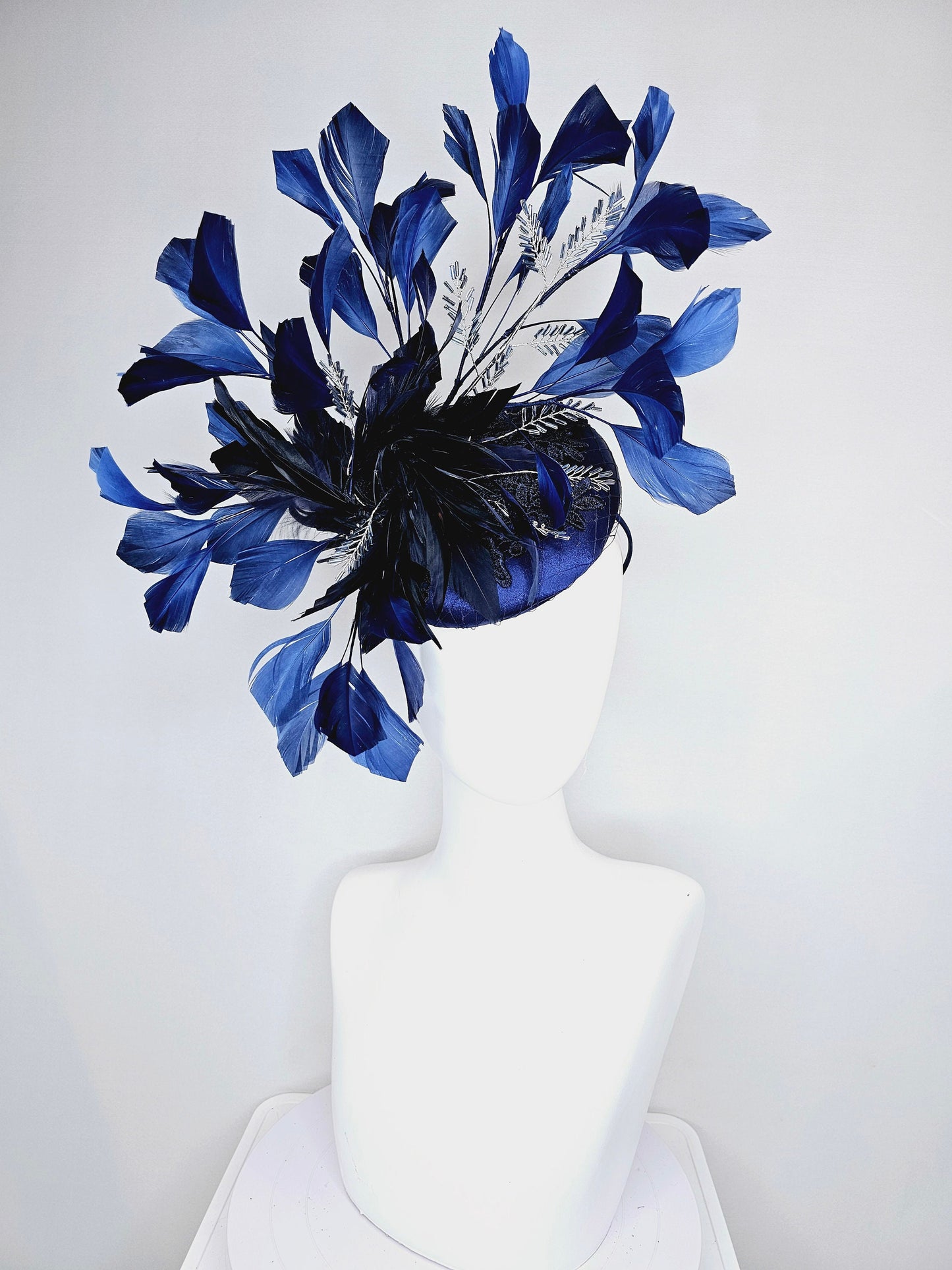 kentucky derby hat fascinator navy blue satin with embroidery with navy blue feathers and feather flower with branching silver beaded decor