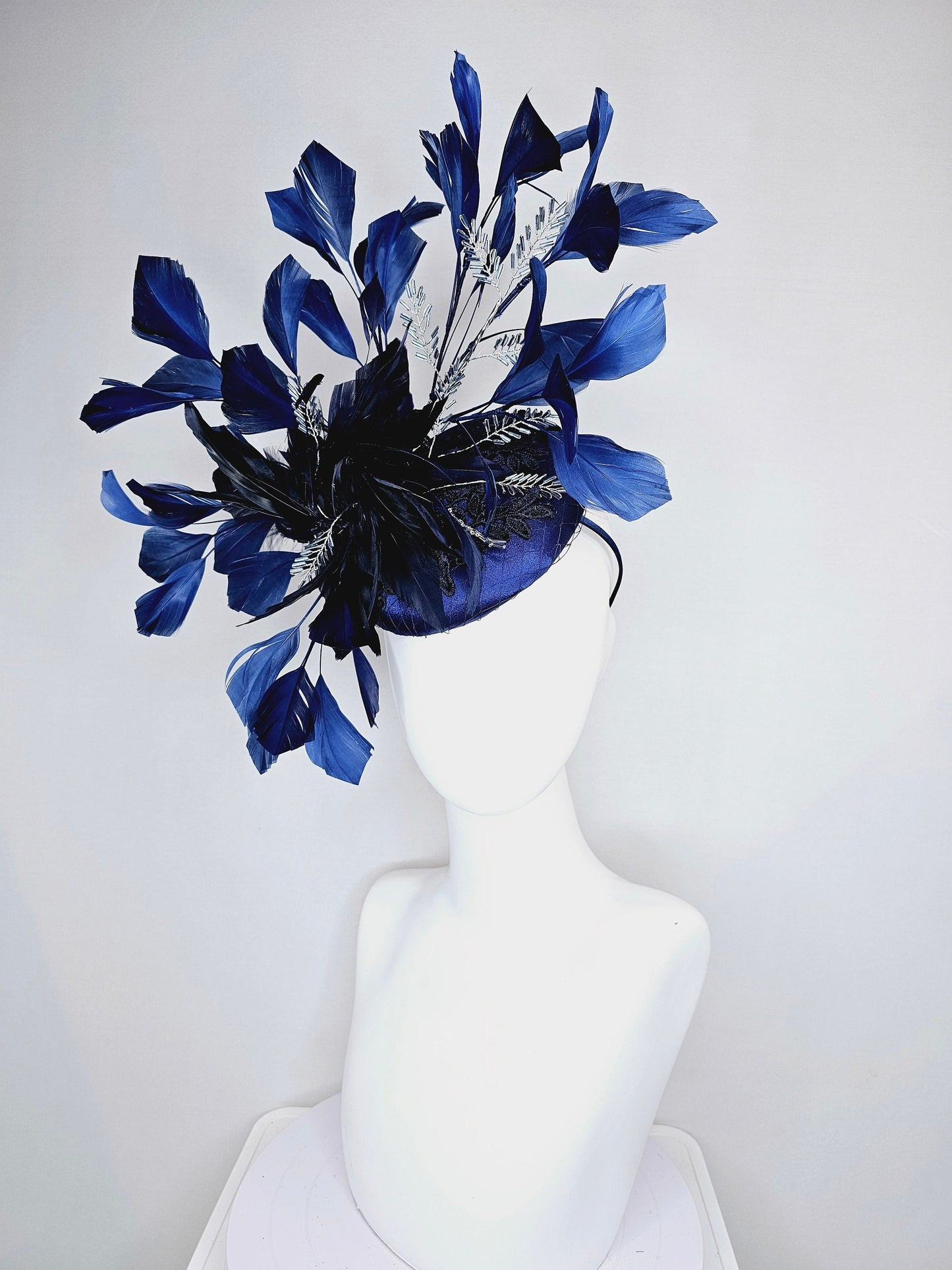 kentucky derby hat fascinator navy blue satin with embroidery with navy blue feathers and feather flower with branching silver beaded decor