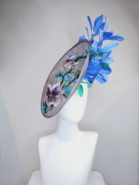 kentucky derby hat fascinator light purple lavender sinamay saucer with blue green feathers and blue green  gold embroidered flowers