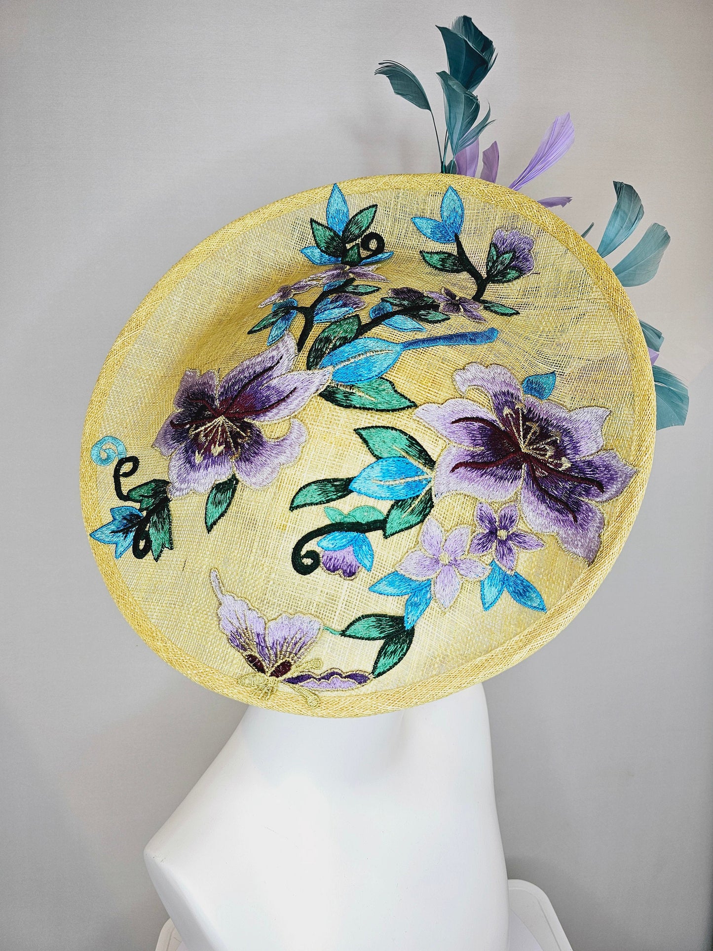 kentucky derby hat fascinator yellow sinamay saucer with blue violet purple feathers and blue lavender purple  gold embroidered flowers