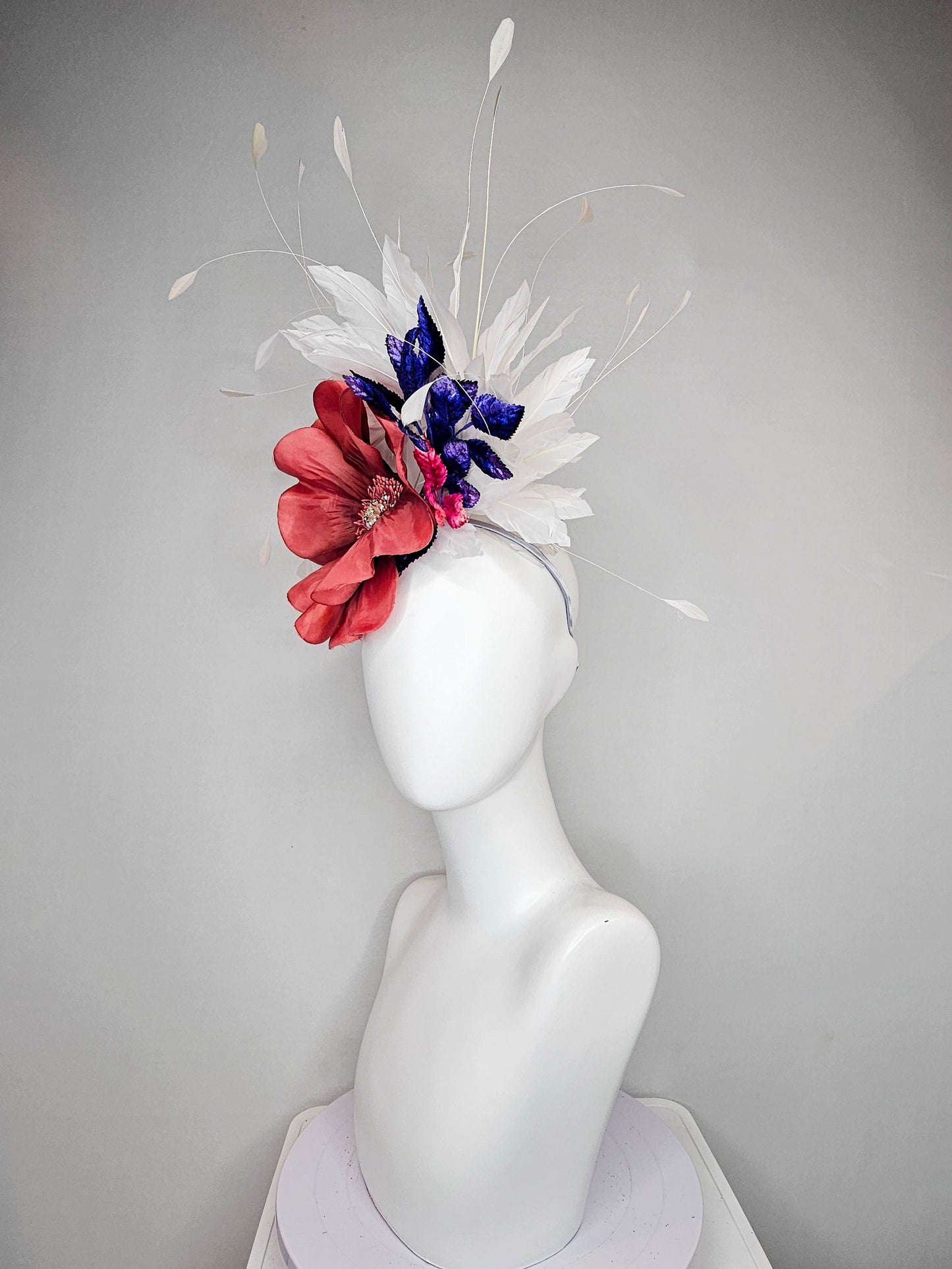 kentucky derby hat fascinator hat coral sinamay base large coral burnt orange flower with white feathers purple royal blue pink leaves