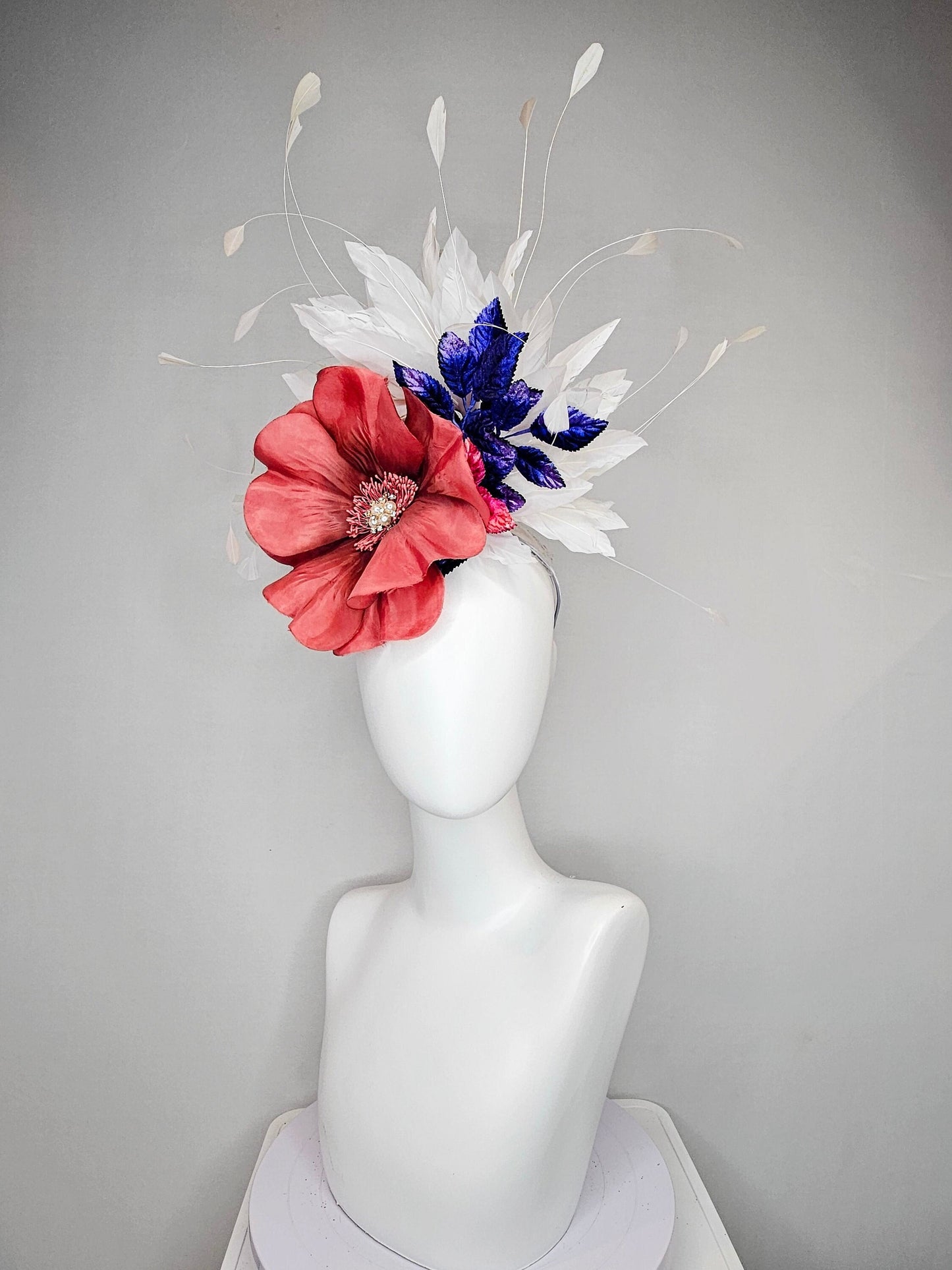 kentucky derby hat fascinator hat coral sinamay base large coral burnt orange flower with white feathers purple royal blue pink leaves