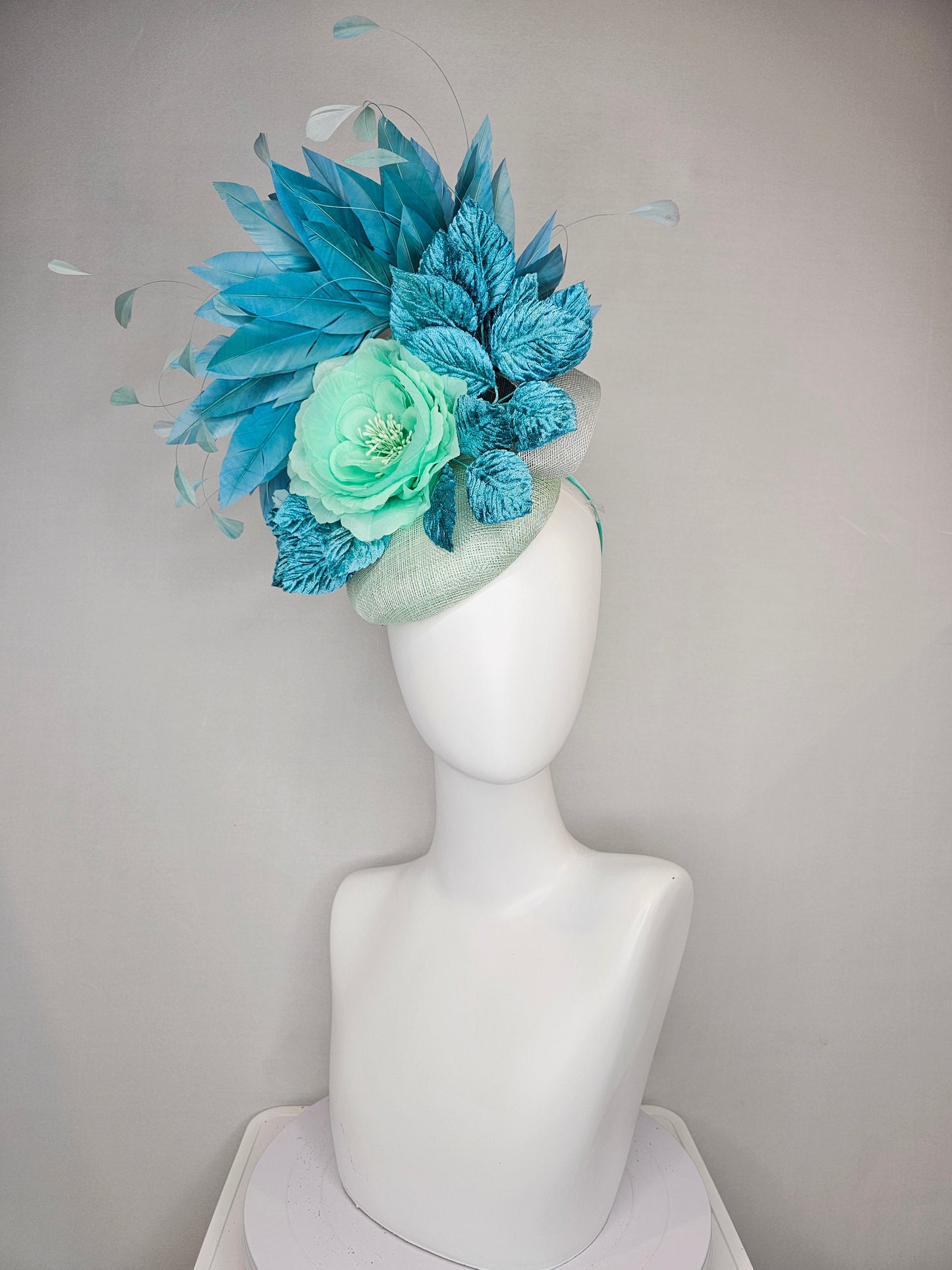 kentucky derby hat fascinator light ice blue green sinamay with mint green silk flower teal leaves teal green blue feathers