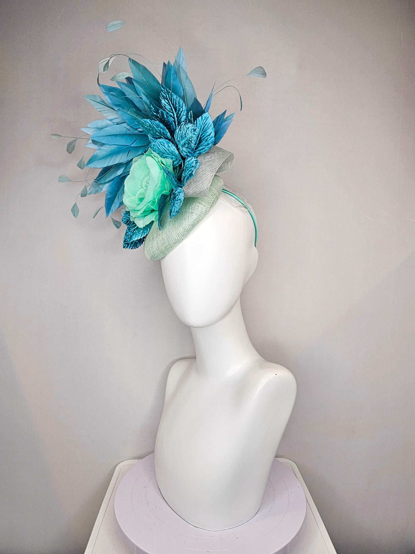 kentucky derby hat fascinator light ice blue green sinamay with mint green silk flower teal leaves teal green blue feathers