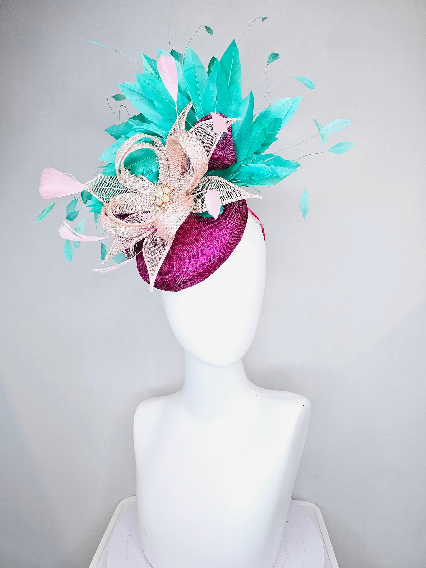 kentucky derby hat fascinator purple magenta sinmaay blush pink sinamay flower with pearls and bright green feathers