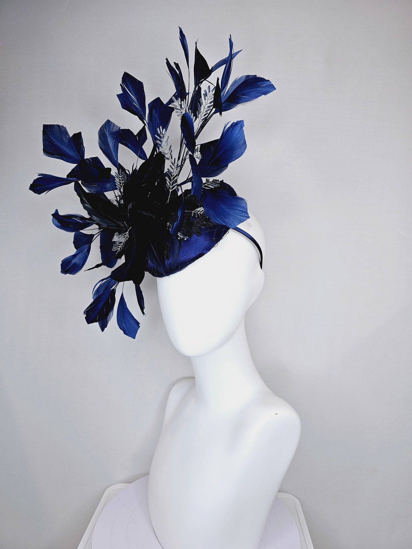 kentucky derby hat fascinator navy blue satin with embroidery with navy blue feathers and feather flower with branching silver beaded decor