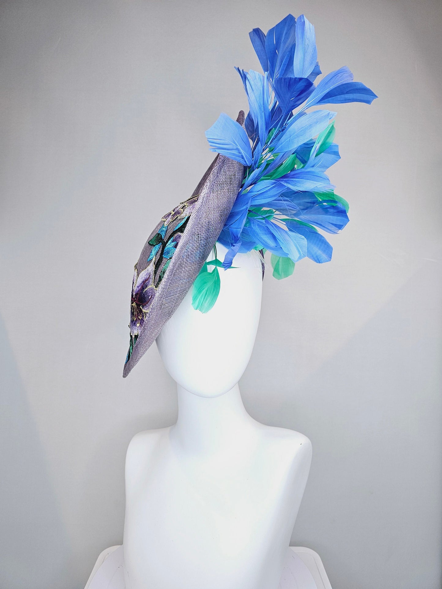 kentucky derby hat fascinator light purple lavender sinamay saucer with blue green feathers and blue green  gold embroidered flowers