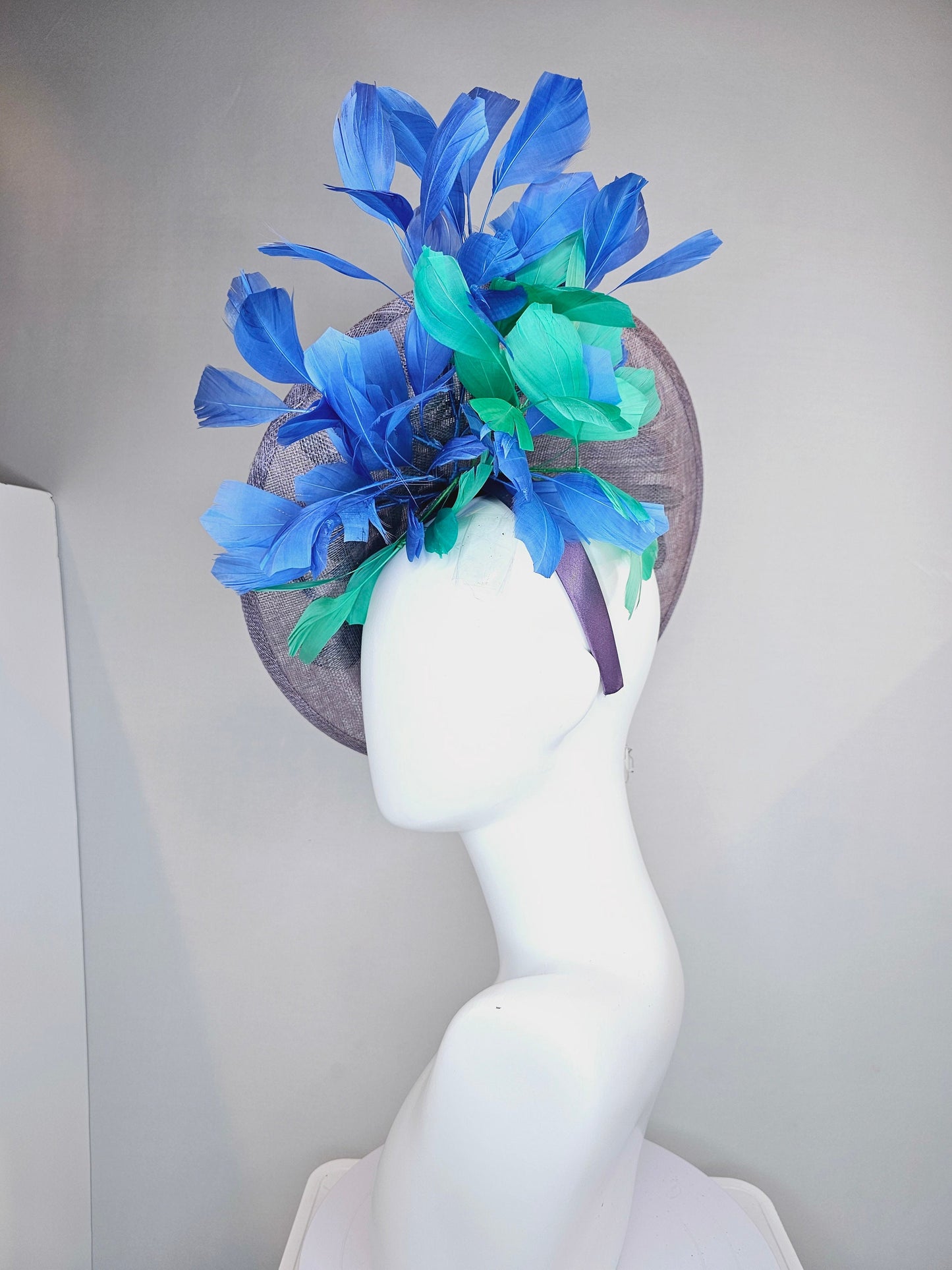 kentucky derby hat fascinator light purple lavender sinamay saucer with blue green feathers and blue green  gold embroidered flowers