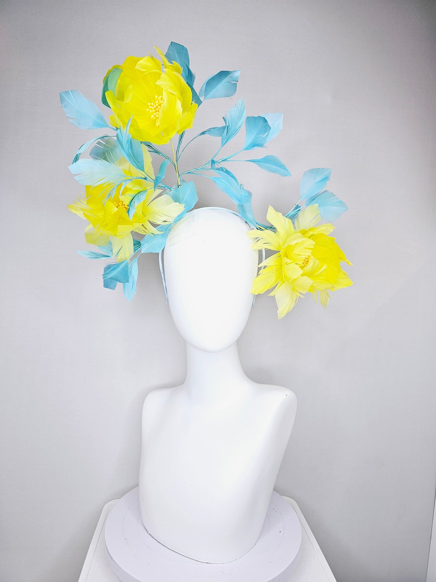 kentucky derby hat fascinator large fluffy yellow feather flowers with peacock blue teal feathers