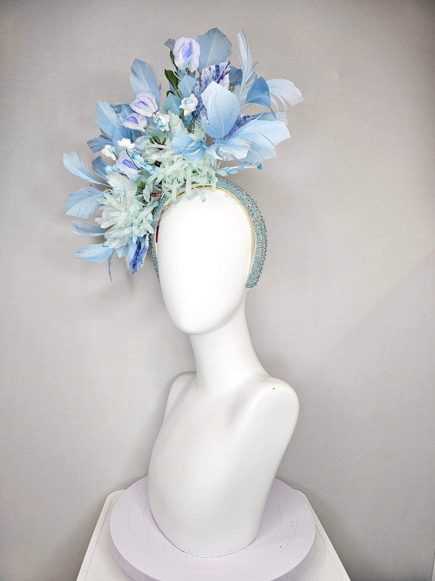 kentucky derby hat fascinator blue rhinestone crystal headband with light green mint and blue silk flowers and leaves light blue feathers