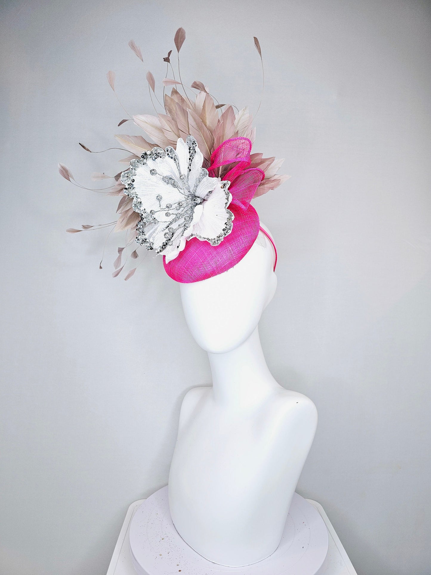 kentucky derby hat fascinator bright  hot pink fuchsia sinamay with large white silver flower with taupe heather neutral feathers