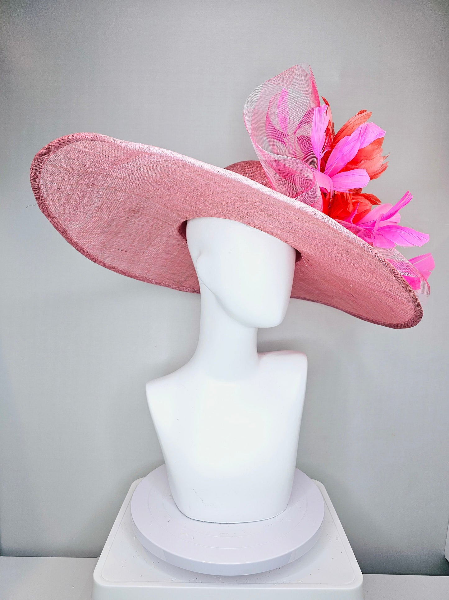 kentucky derby hat large wide brim sinamay light pink hat with large pink feather orange coral feather flowers and  crinoline