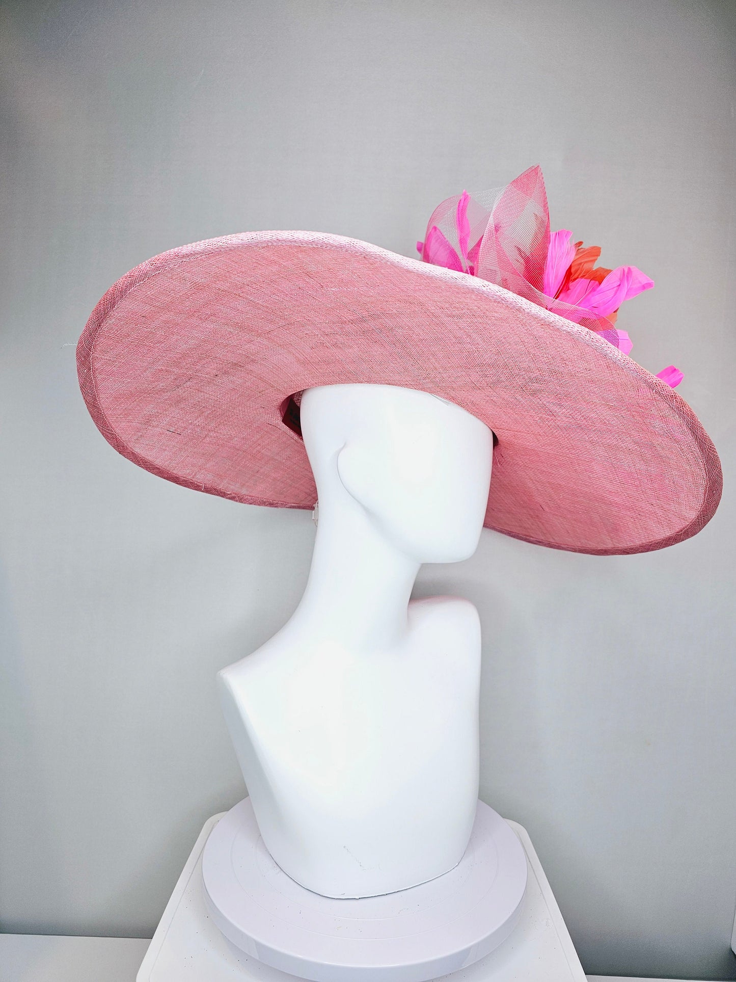 kentucky derby hat large wide brim sinamay light pink hat with large pink feather orange coral feather flowers and  crinoline