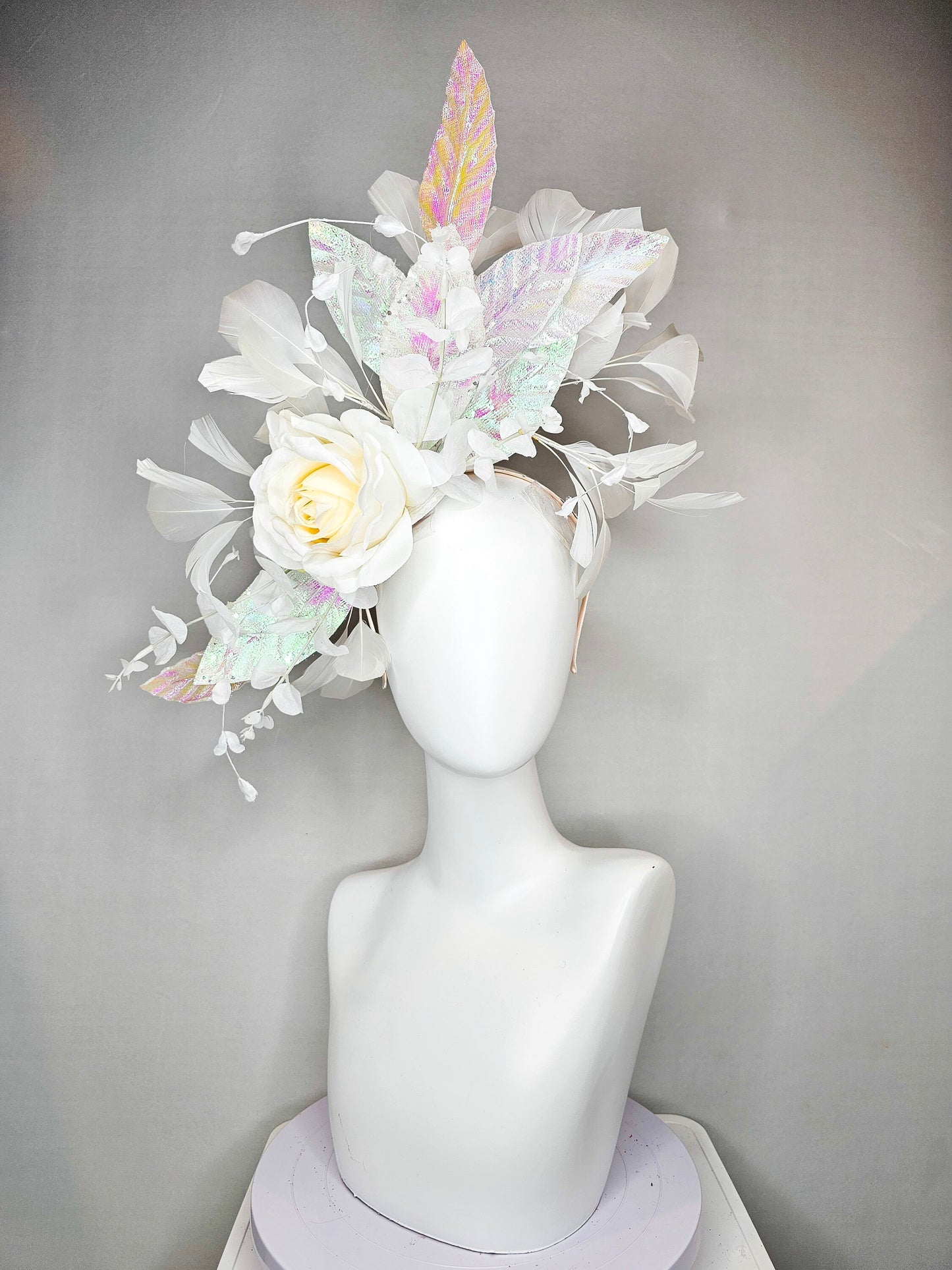 kentucky derby hat fascinator white ivory rose flower with white iridescent pastel rainbow leaves white pearls white feathers