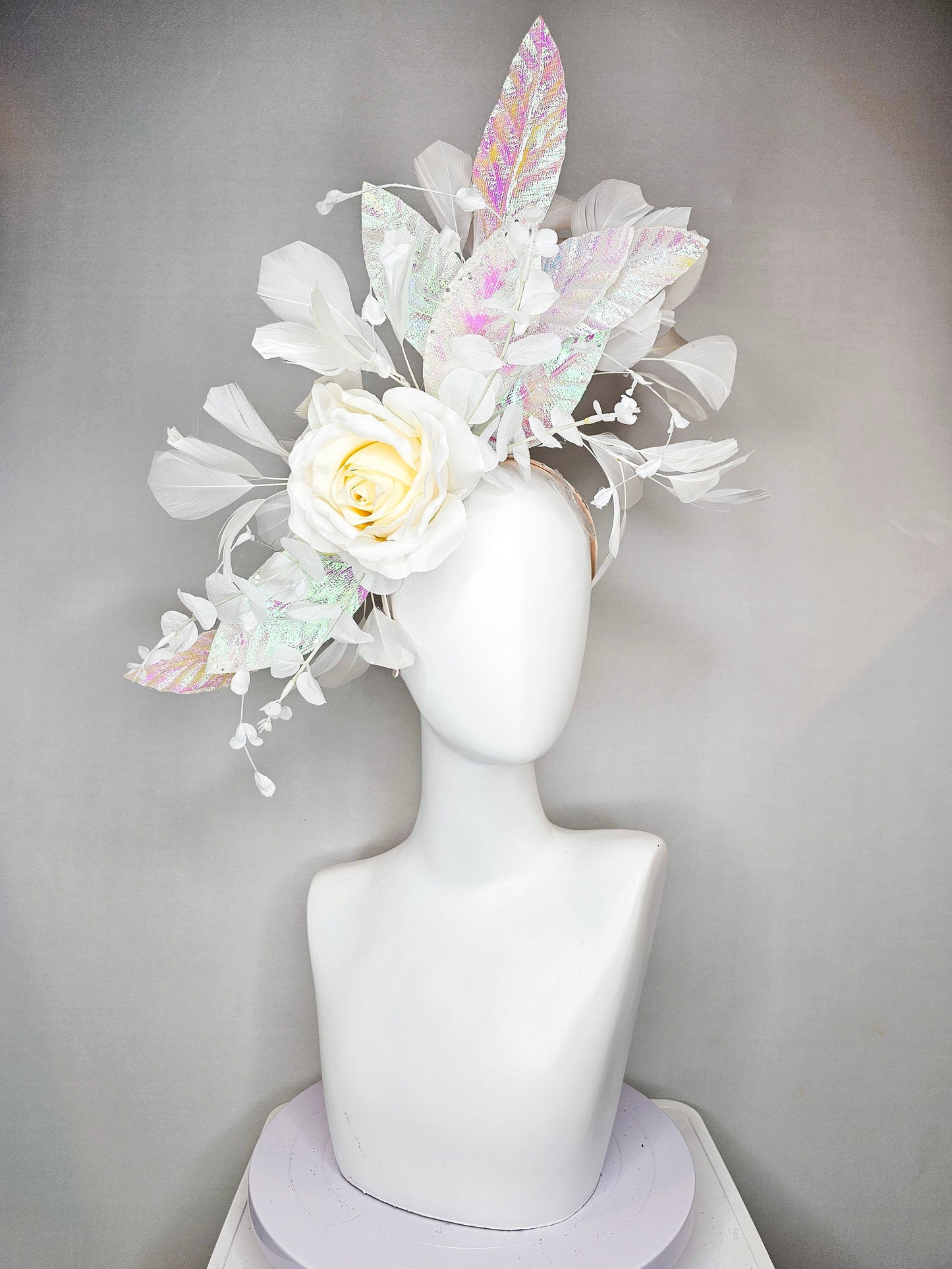 kentucky derby hat fascinator white ivory rose flower with white iridescent pastel rainbow leaves white pearls white feathers