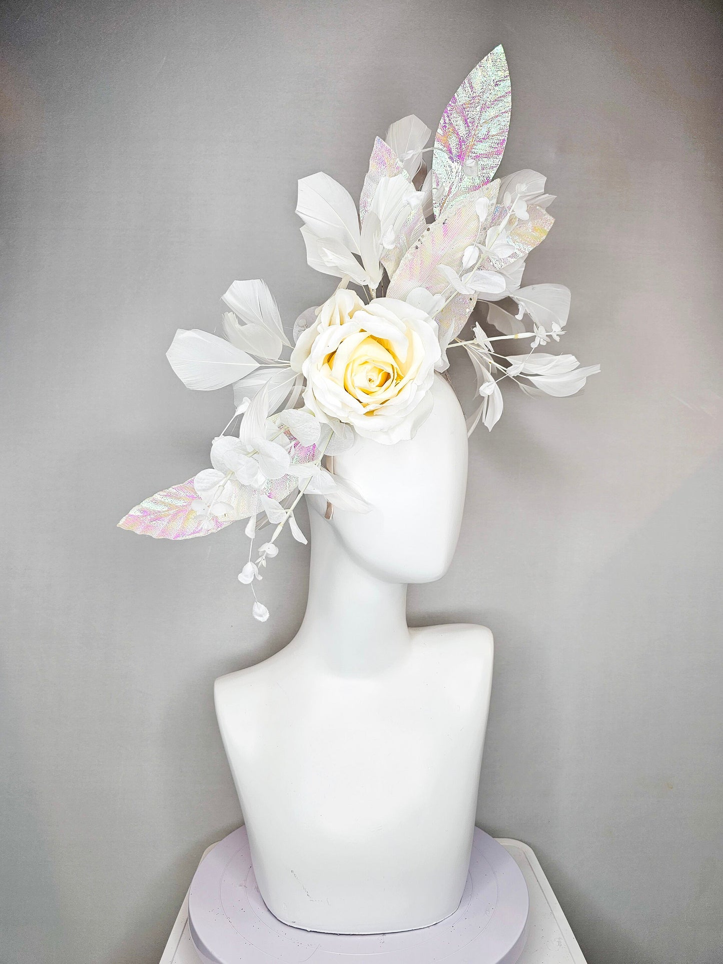 kentucky derby hat fascinator white ivory rose flower with white iridescent pastel rainbow leaves white pearls white feathers