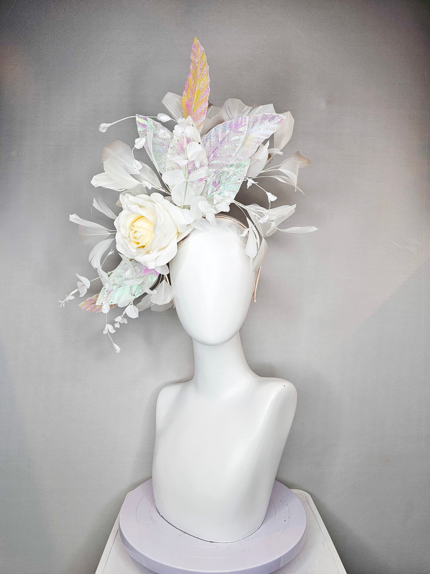 kentucky derby hat fascinator white ivory rose flower with white iridescent pastel rainbow leaves white pearls white feathers