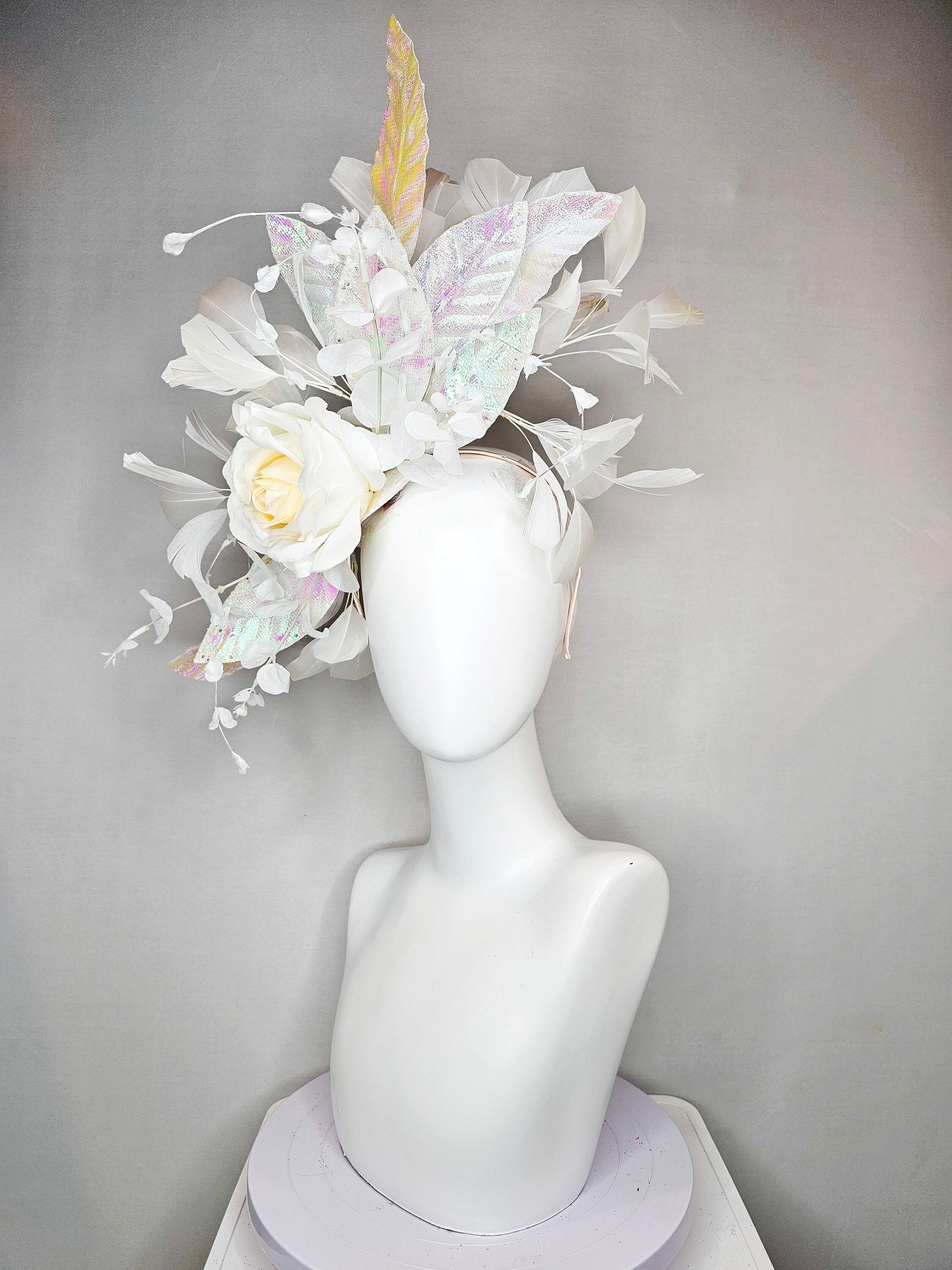 kentucky derby hat fascinator white ivory rose flower with white iridescent pastel rainbow leaves white pearls white feathers