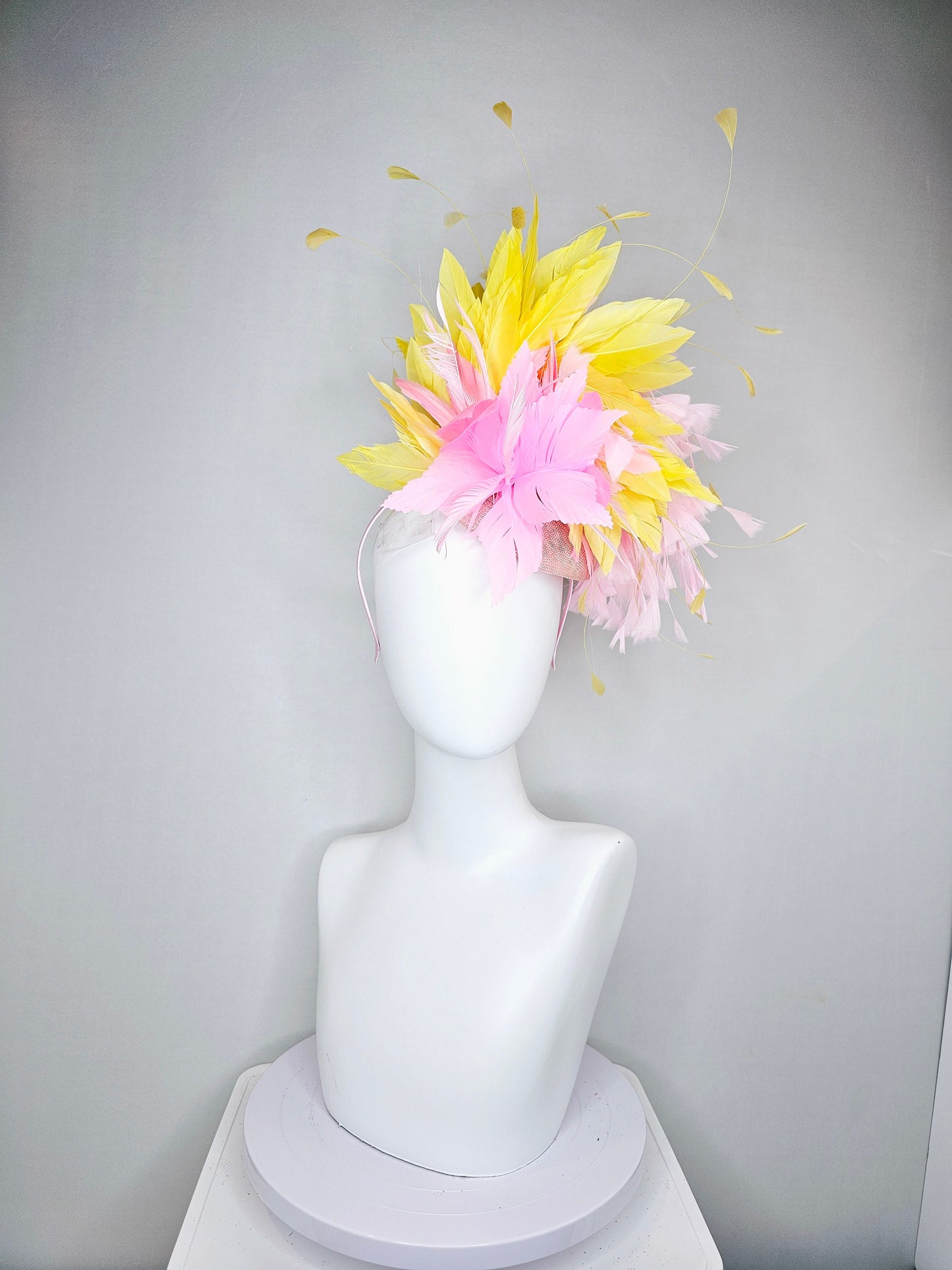 kentucky derby hat fascinator blush pink sinamay with pink feather flower and feathers with yellow feathers