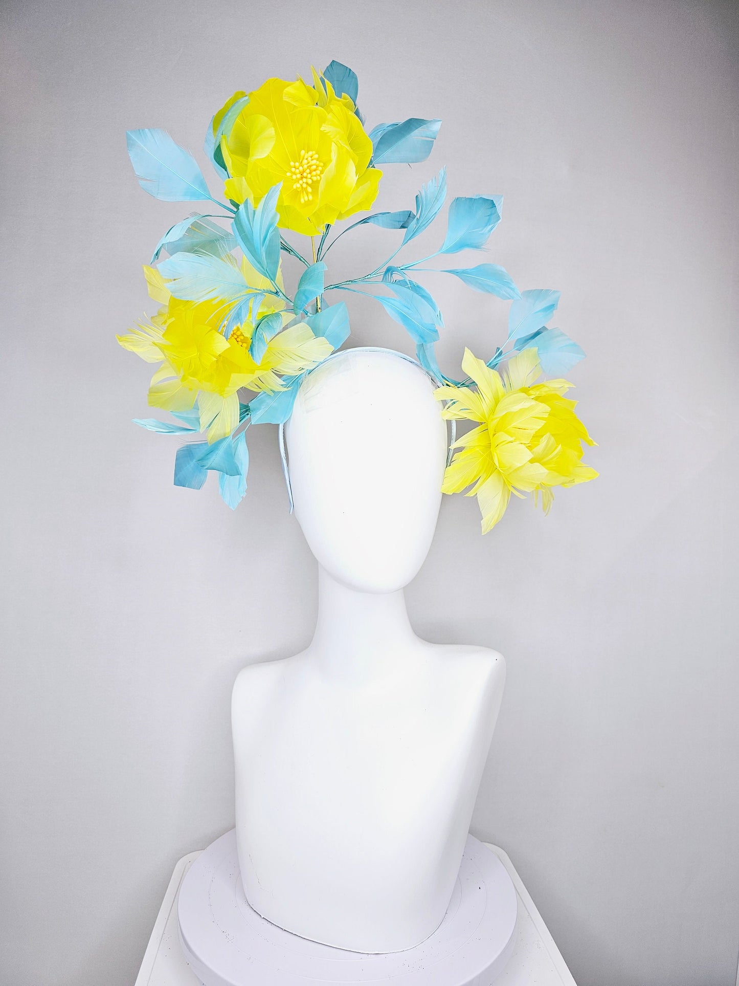 kentucky derby hat fascinator large fluffy yellow feather flowers with peacock blue teal feathers