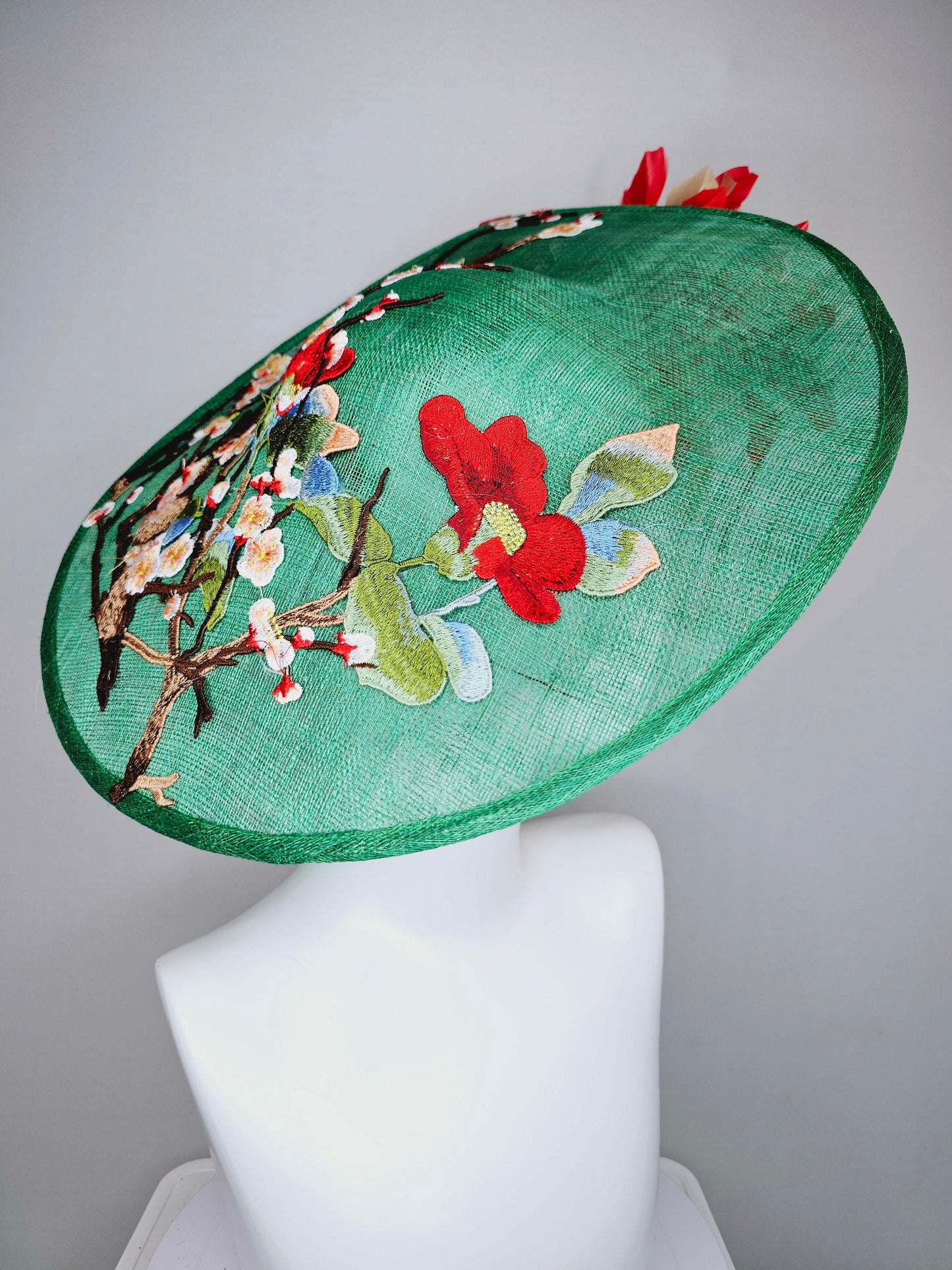 kentucky derby hat fascinator green sinamay saucer with embroidered gold red brown ivory flowers and red and gold  feathers