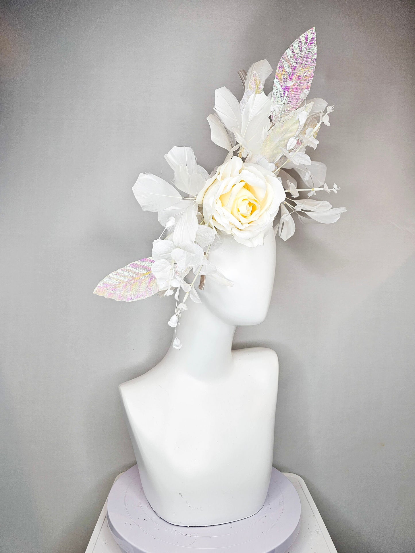 kentucky derby hat fascinator white ivory rose flower with white iridescent pastel rainbow leaves white pearls white feathers