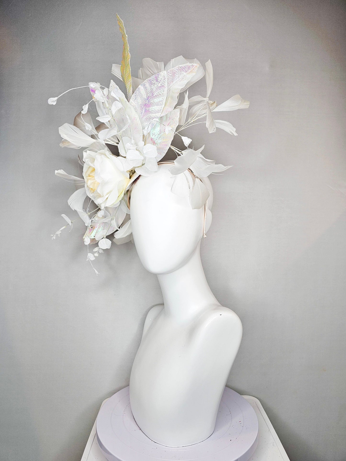 kentucky derby hat fascinator white ivory rose flower with white iridescent pastel rainbow leaves white pearls white feathers