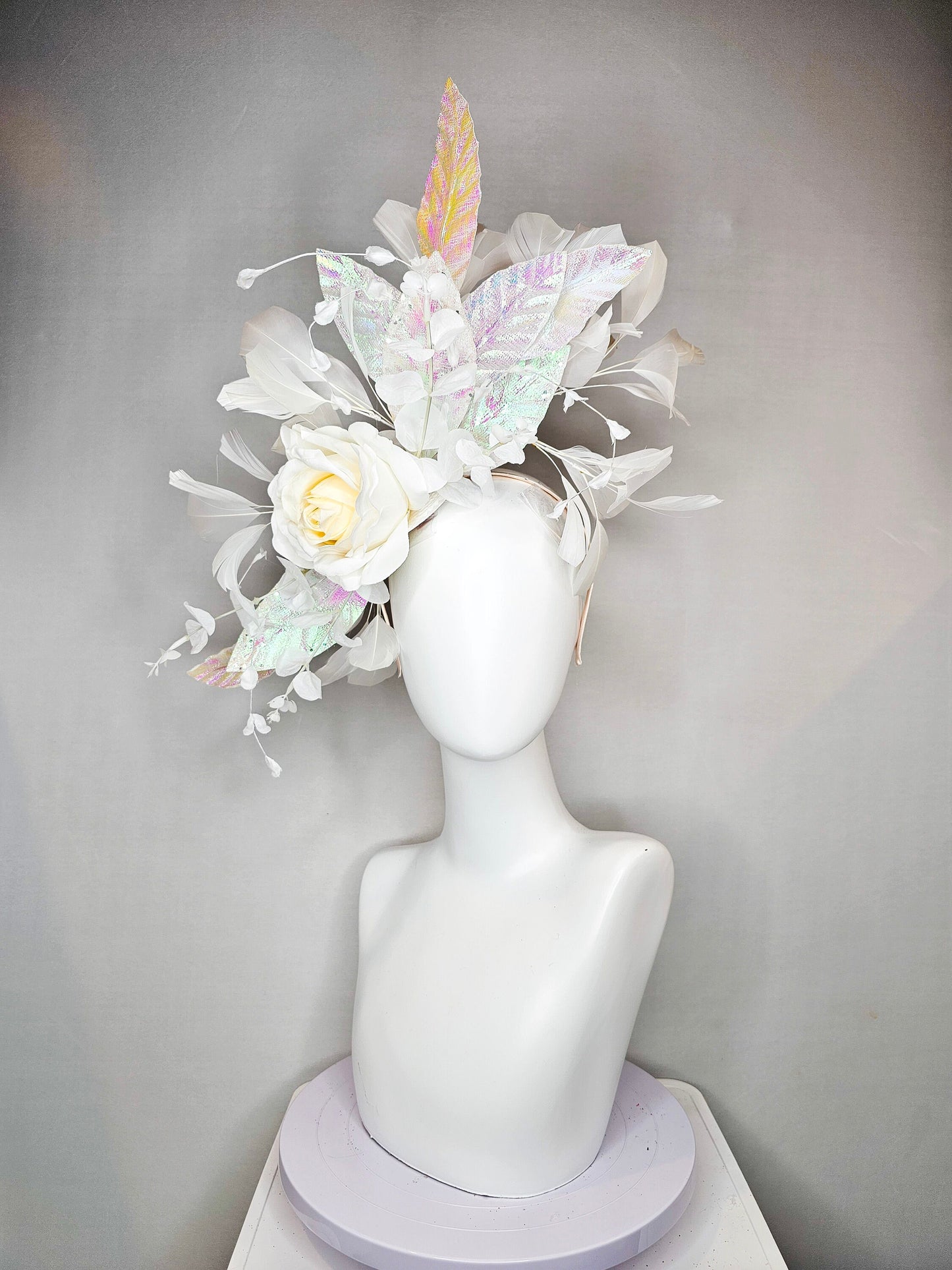 kentucky derby hat fascinator white ivory rose flower with white iridescent pastel rainbow leaves white pearls white feathers