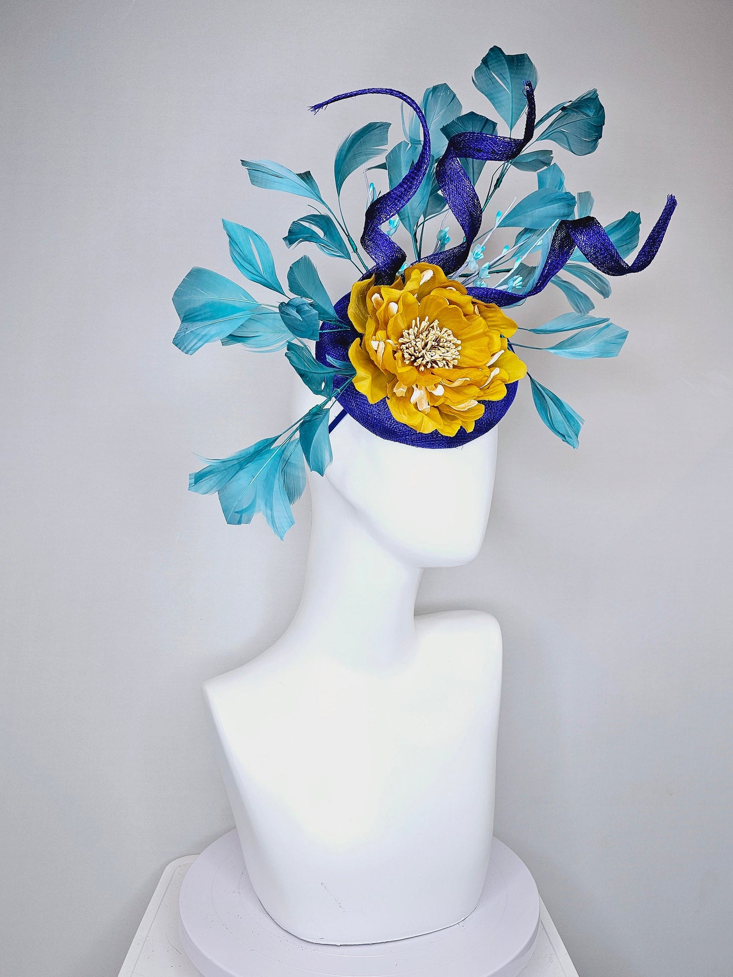 kentucky derby hat fascinator royal blue sinamay with curls mustard yellow large flower with teal peacock blue  feathers