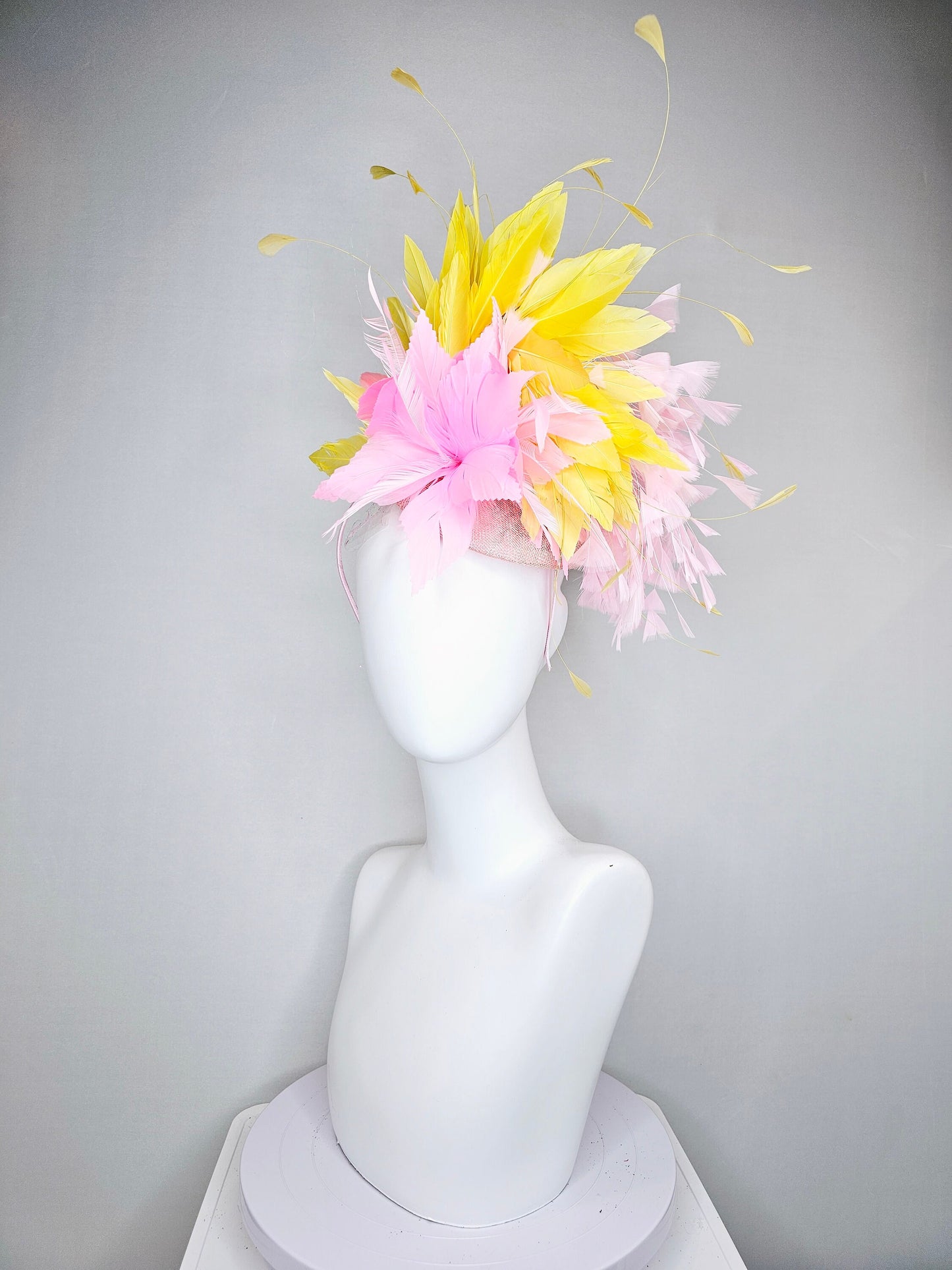 kentucky derby hat fascinator blush pink sinamay with pink feather flower and feathers with yellow feathers