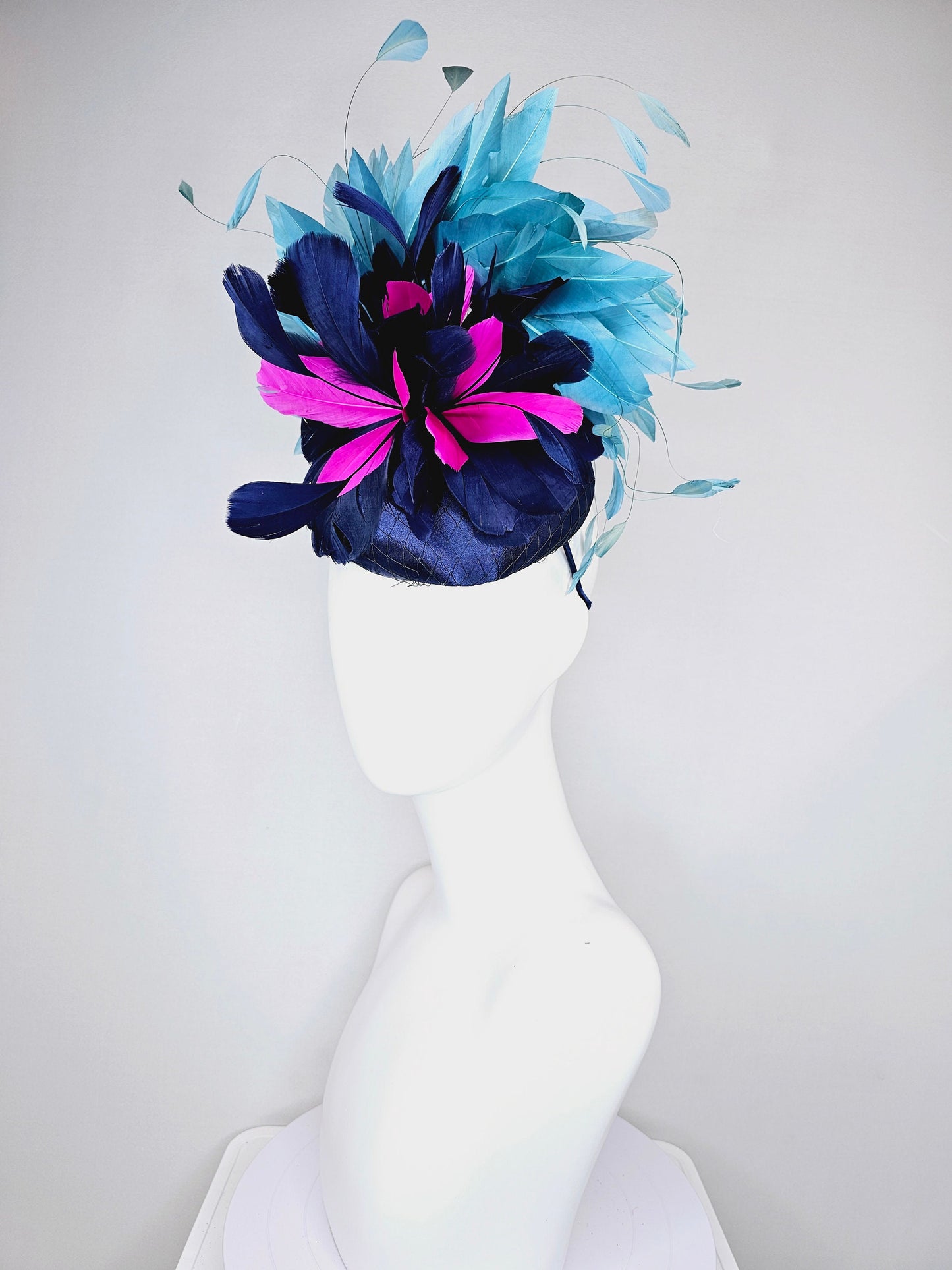 kentucky derby hat fascinator navy blue satin with pink and navy feather flowers with peacock green blue feathers