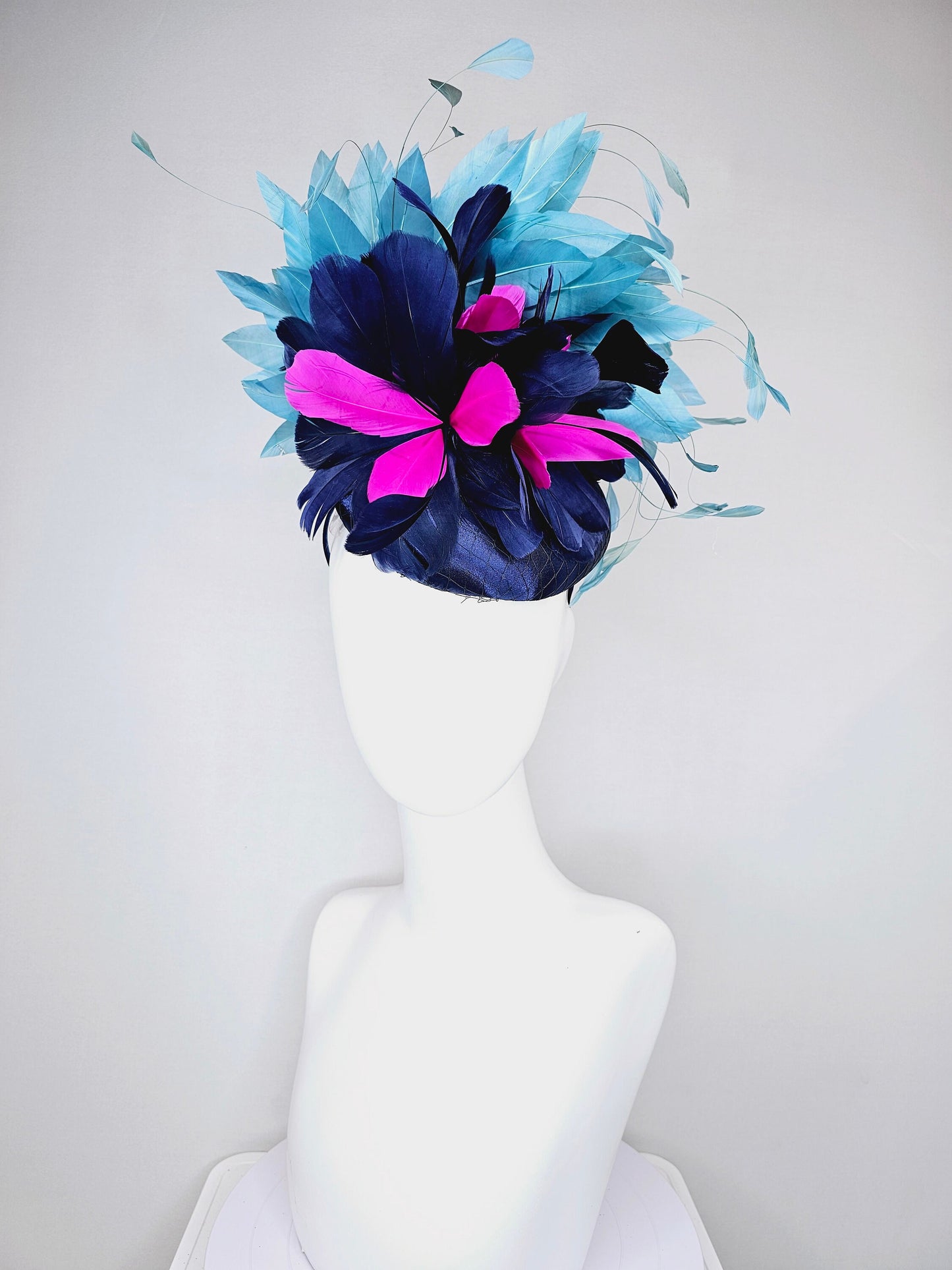 kentucky derby hat fascinator navy blue satin with pink and navy feather flowers with peacock green blue feathers