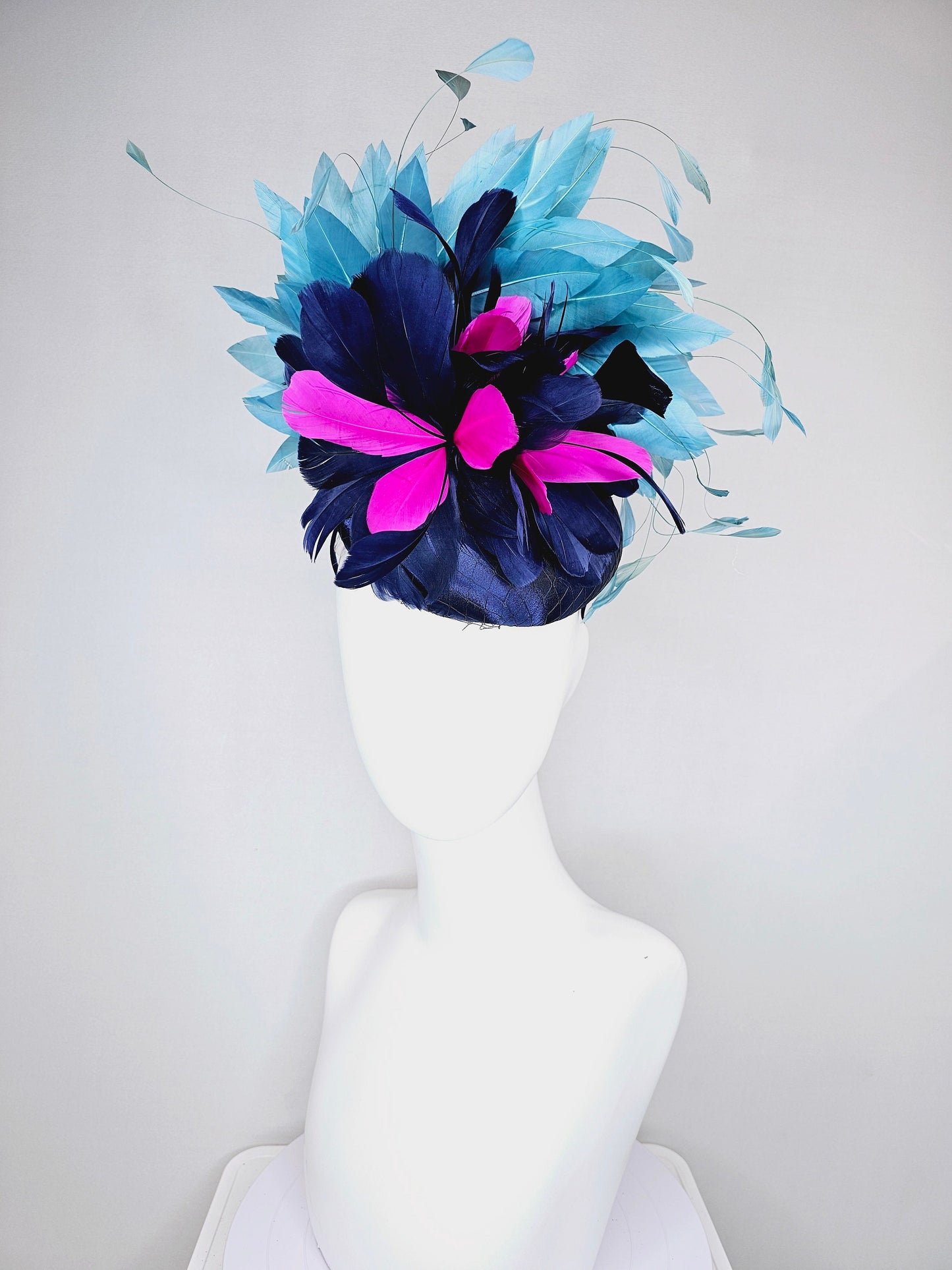 kentucky derby hat fascinator navy blue satin with pink and navy feather flowers with peacock green blue feathers