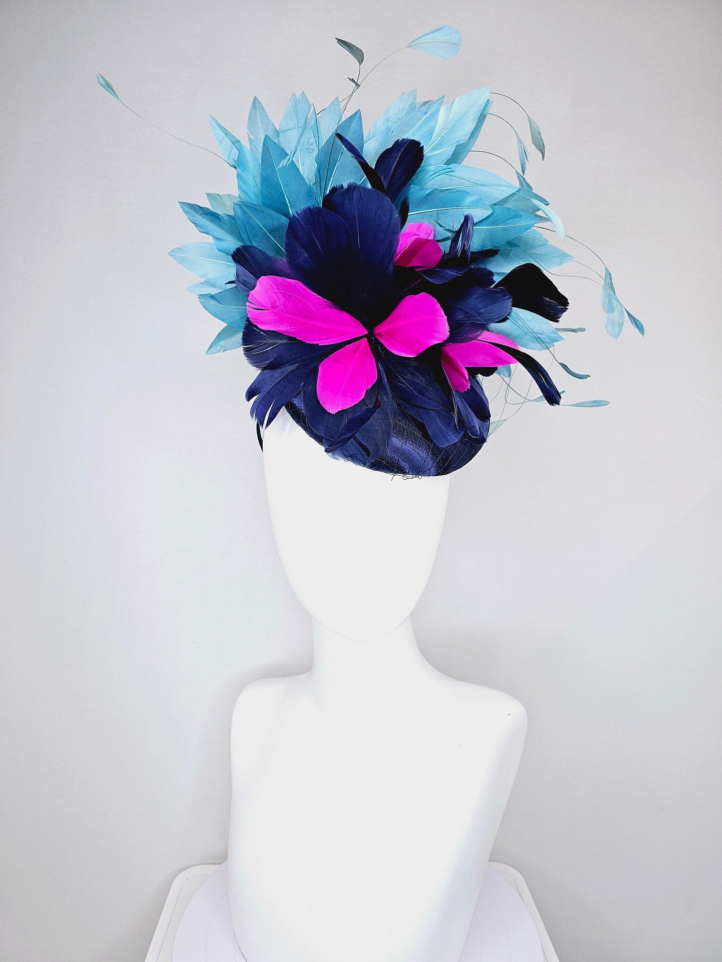 kentucky derby hat fascinator navy blue satin with pink and navy feather flowers with peacock green blue feathers