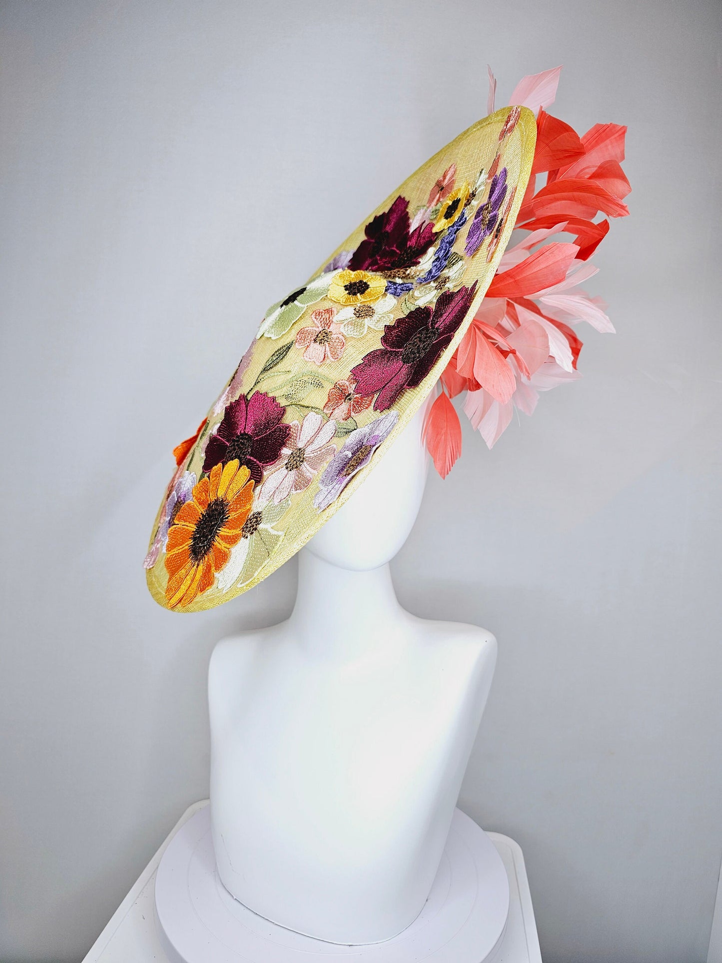 kentucky derby hat fascinator large yellow saucer sinamay rainbow red orange green pink embroidered flowers  pink coral branching feathers