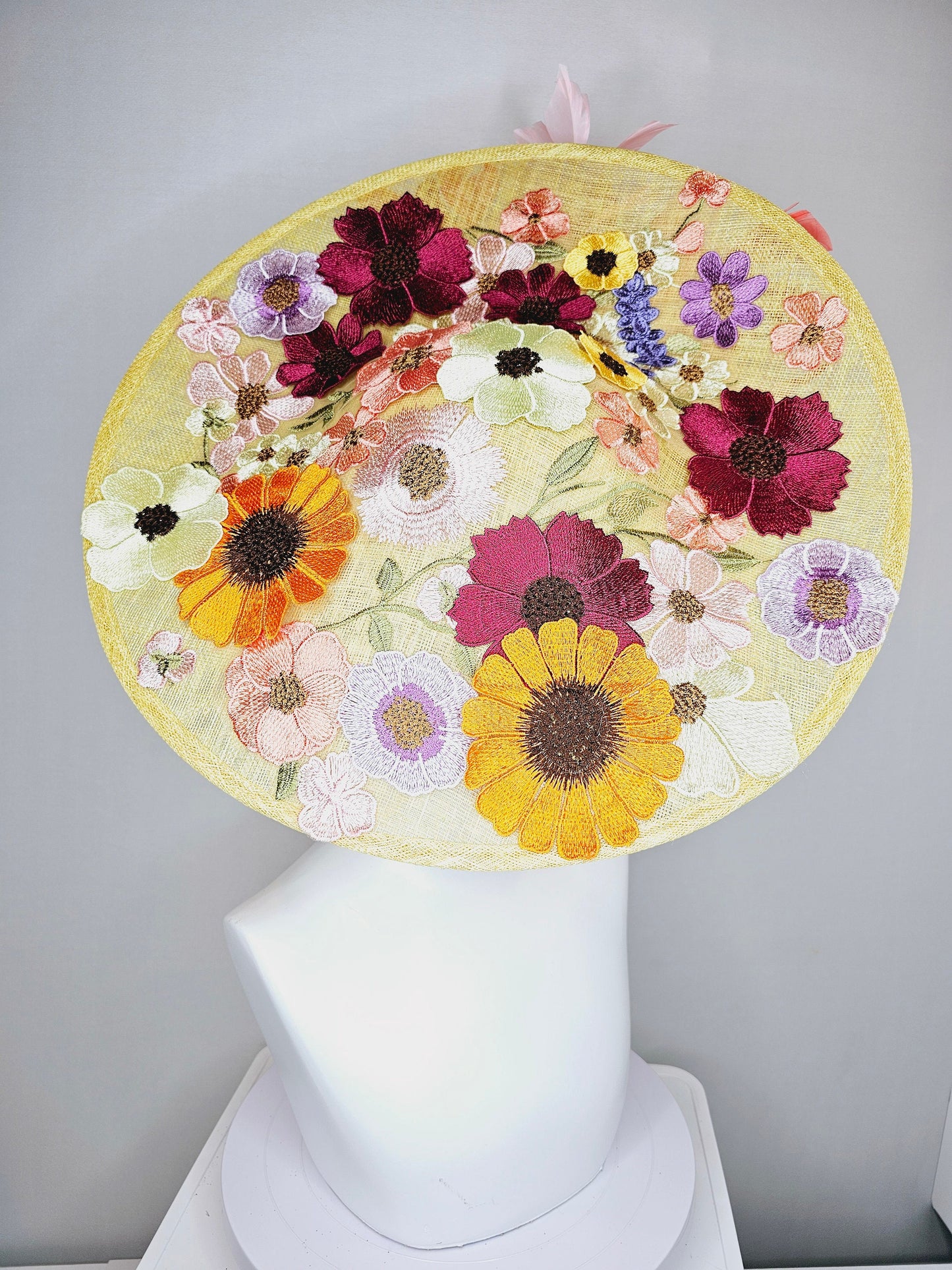 kentucky derby hat fascinator large yellow saucer sinamay rainbow red orange green pink embroidered flowers  pink coral branching feathers