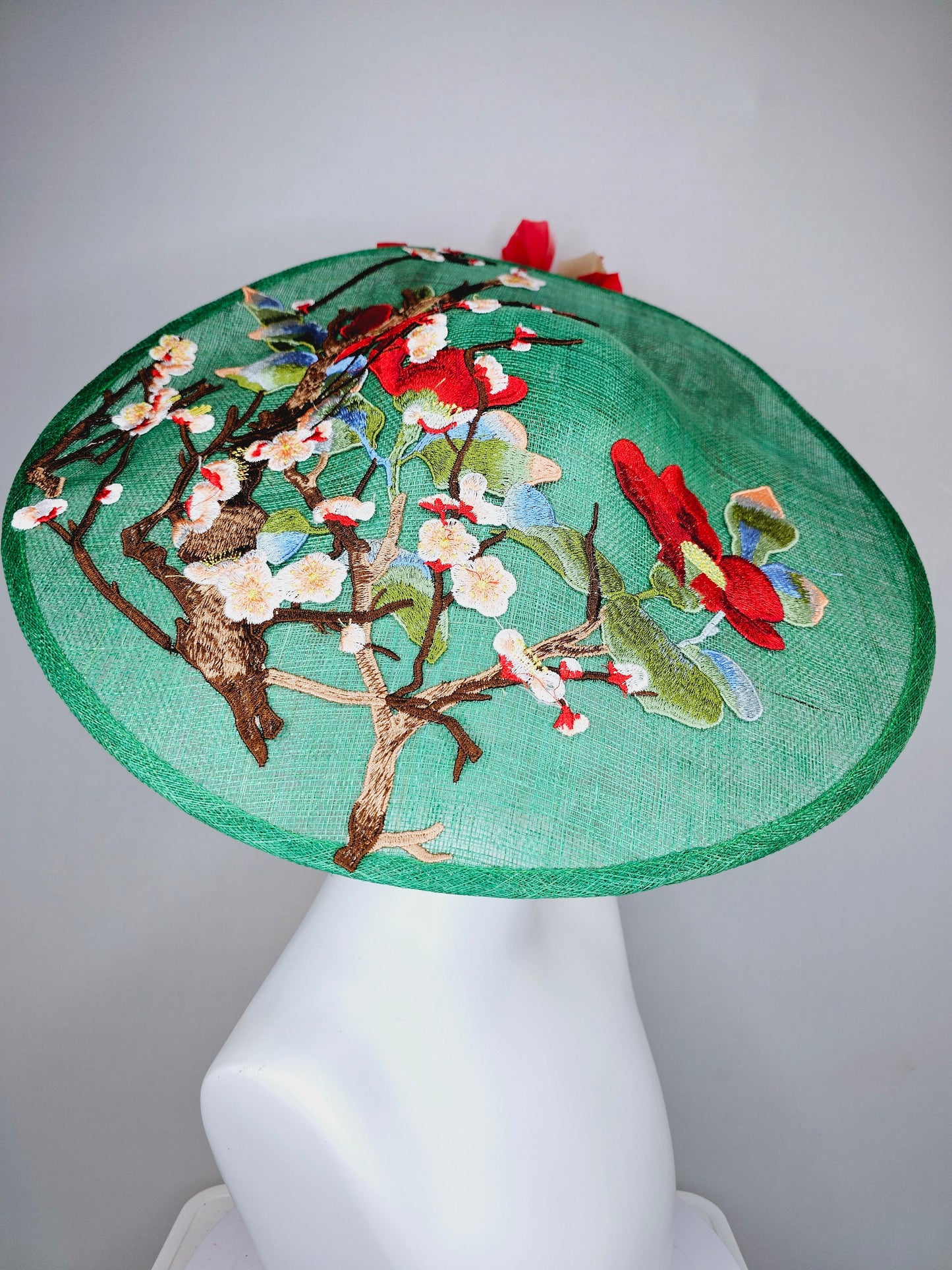 kentucky derby hat fascinator green sinamay saucer with embroidered gold red brown ivory flowers and red and gold  feathers