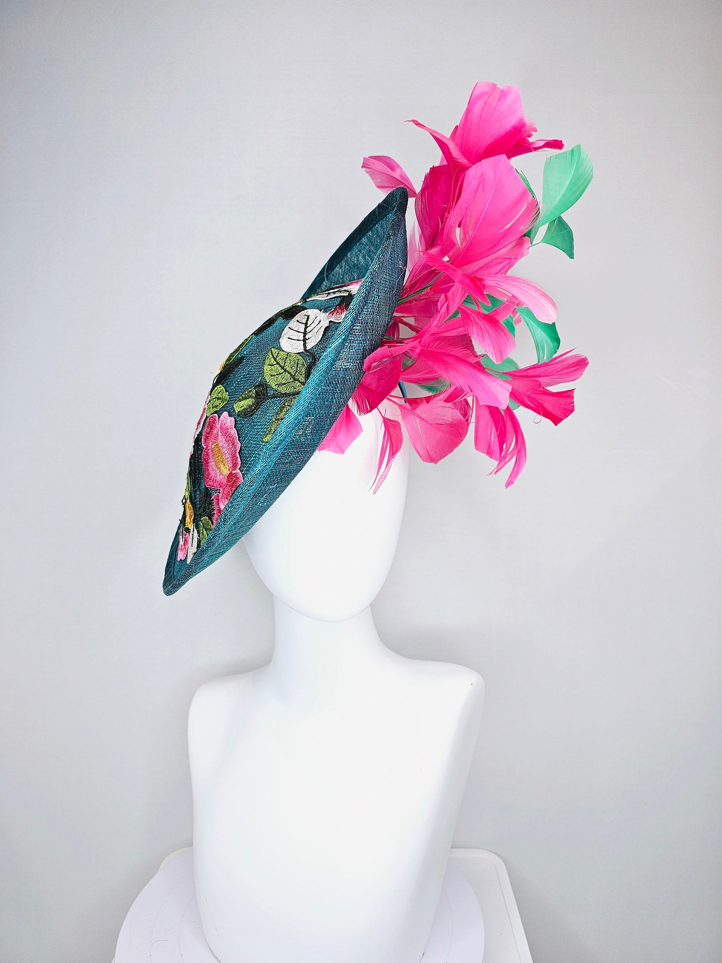 kentucky derby hat fascinator teal sinamay saucer with fuchsia pink and green feathers and yellow pink blue embroidered flowers and birds