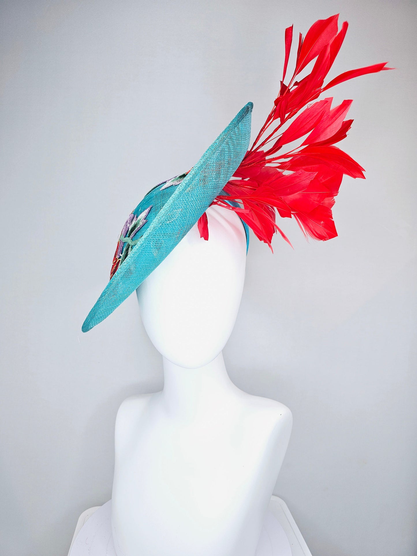 kentucky derby hat fascinator teal turquoise aqua blue sinamay saucer with purple red gold green embroidered flowers with red feathers