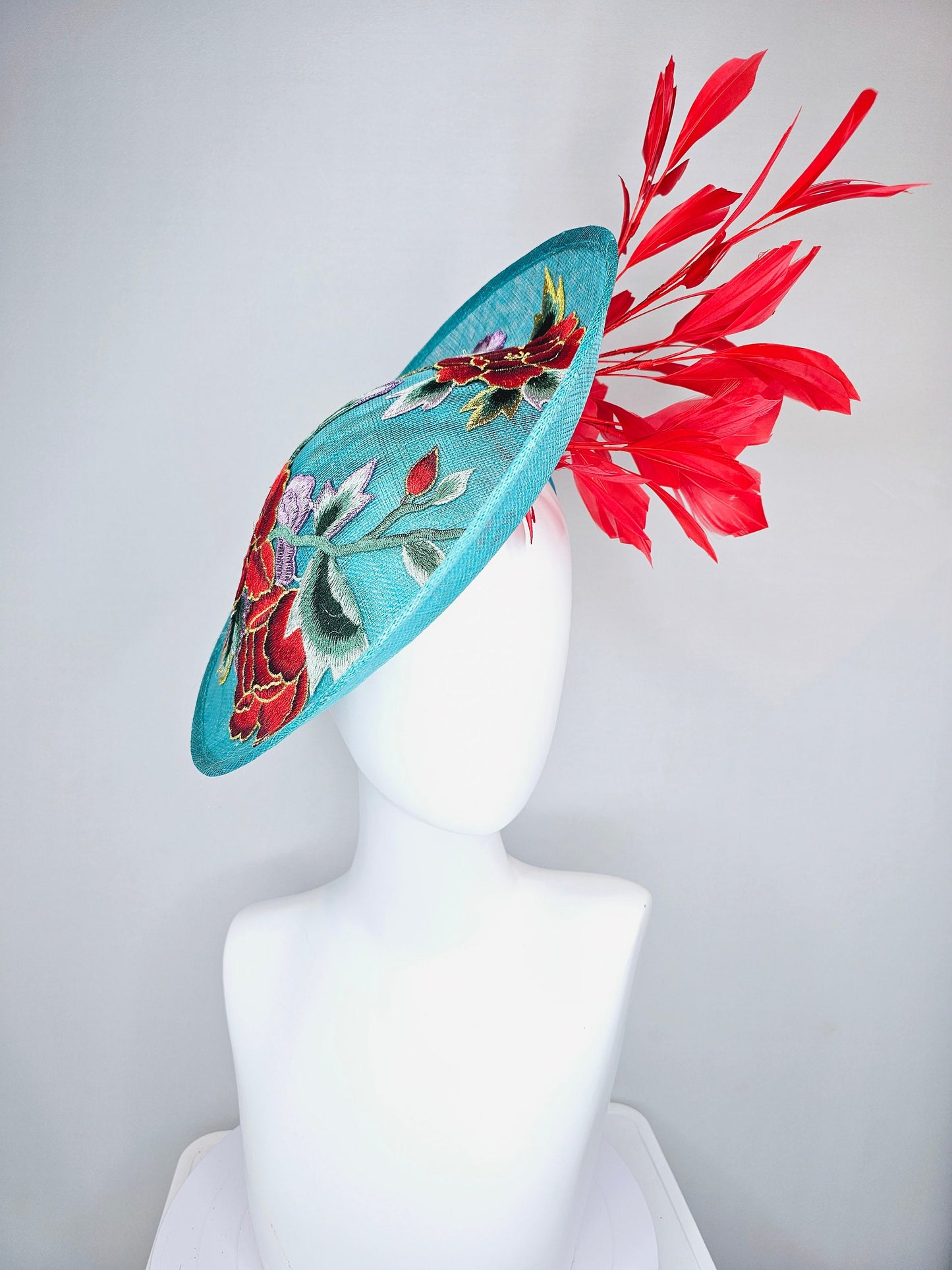 kentucky derby hat fascinator teal turquoise aqua blue sinamay saucer with purple red gold green embroidered flowers with red feathers