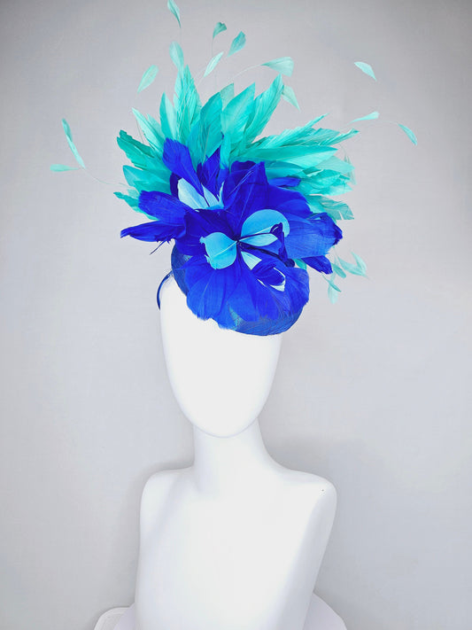 kentucky derby hat fascinator royal blue satin with green feathers and blue green feather flowers