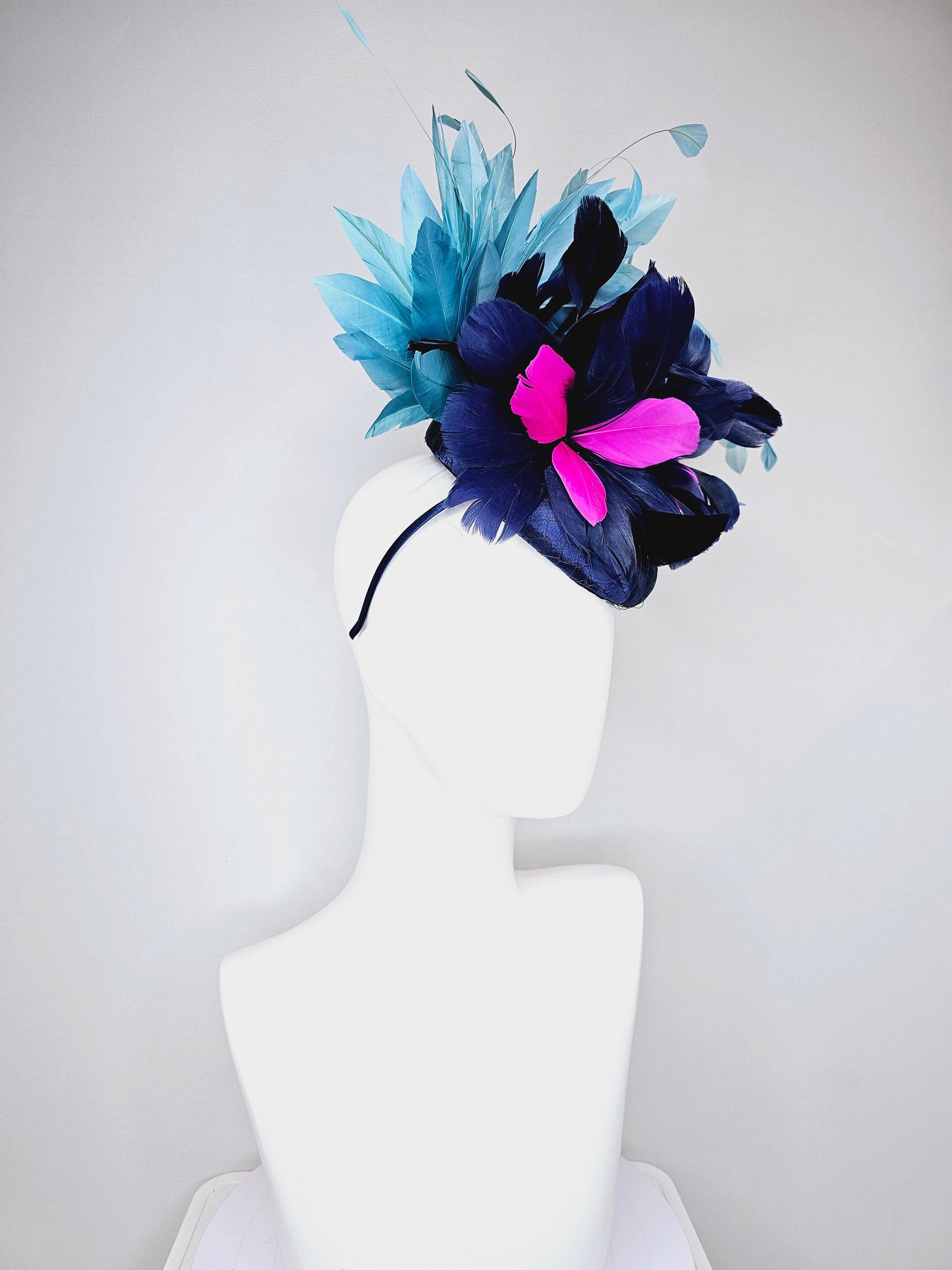 kentucky derby hat fascinator navy blue satin with pink and navy feather flowers with peacock green blue feathers