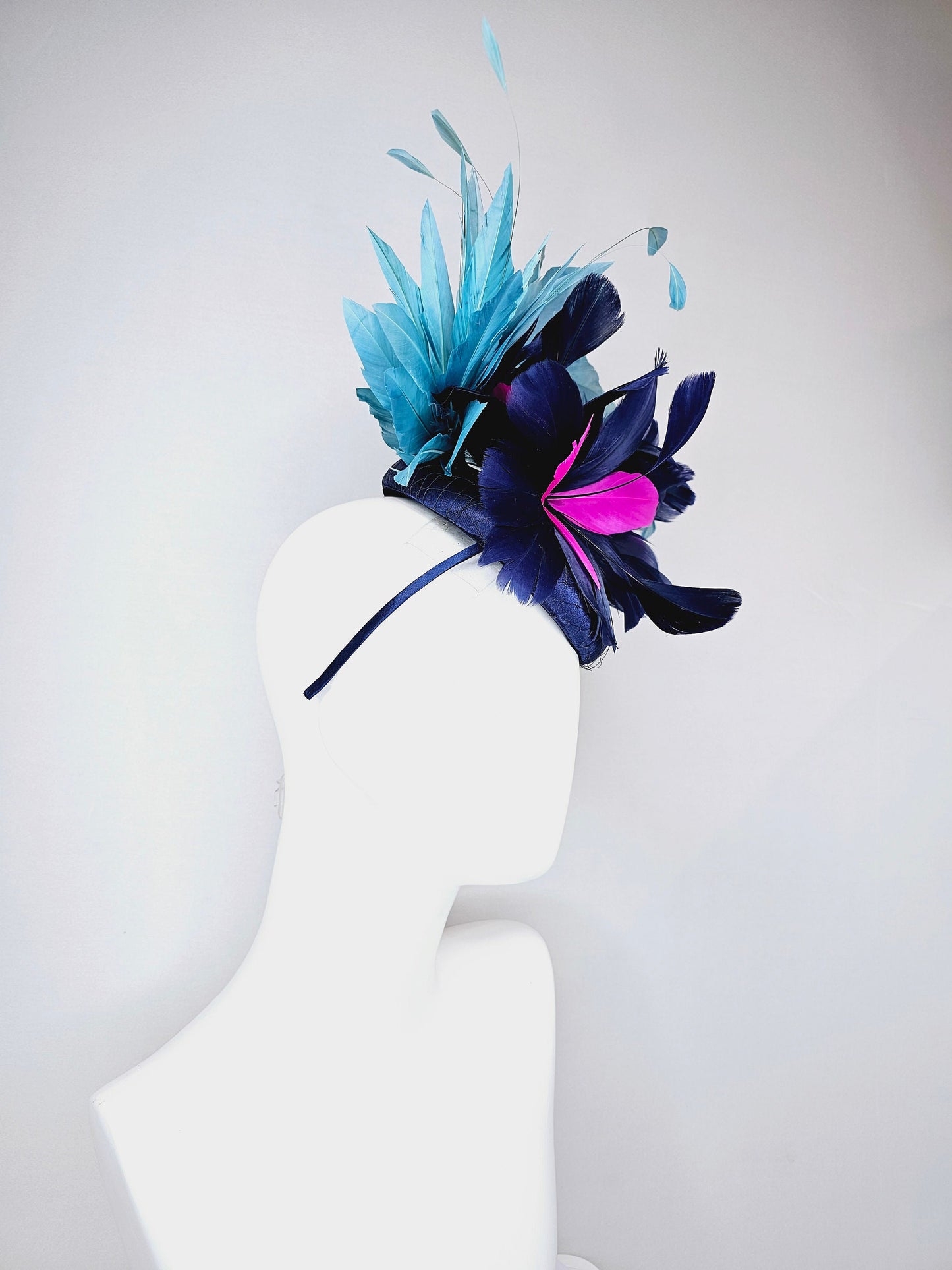 kentucky derby hat fascinator navy blue satin with pink and navy feather flowers with peacock green blue feathers