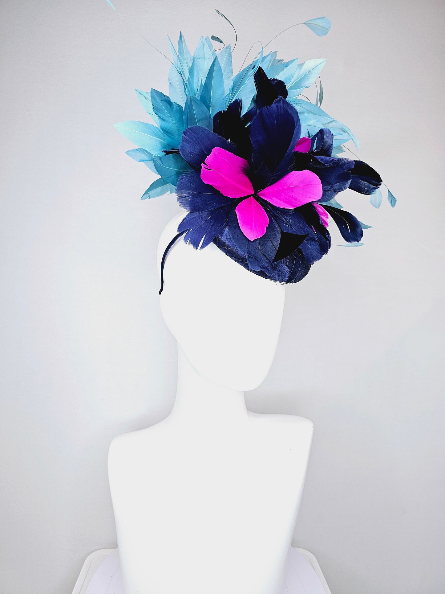 kentucky derby hat fascinator navy blue satin with pink and navy feather flowers with peacock green blue feathers