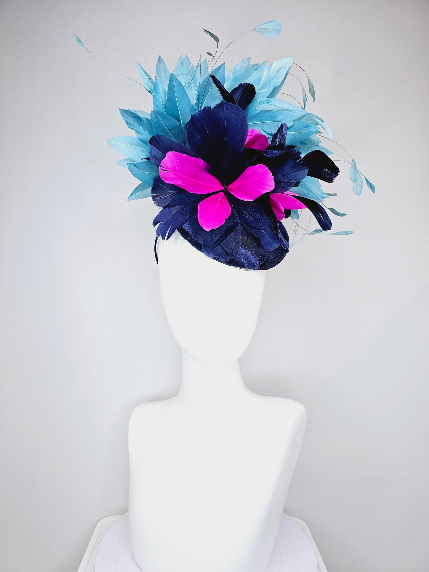 kentucky derby hat fascinator navy blue satin with pink and navy feather flowers with peacock green blue feathers