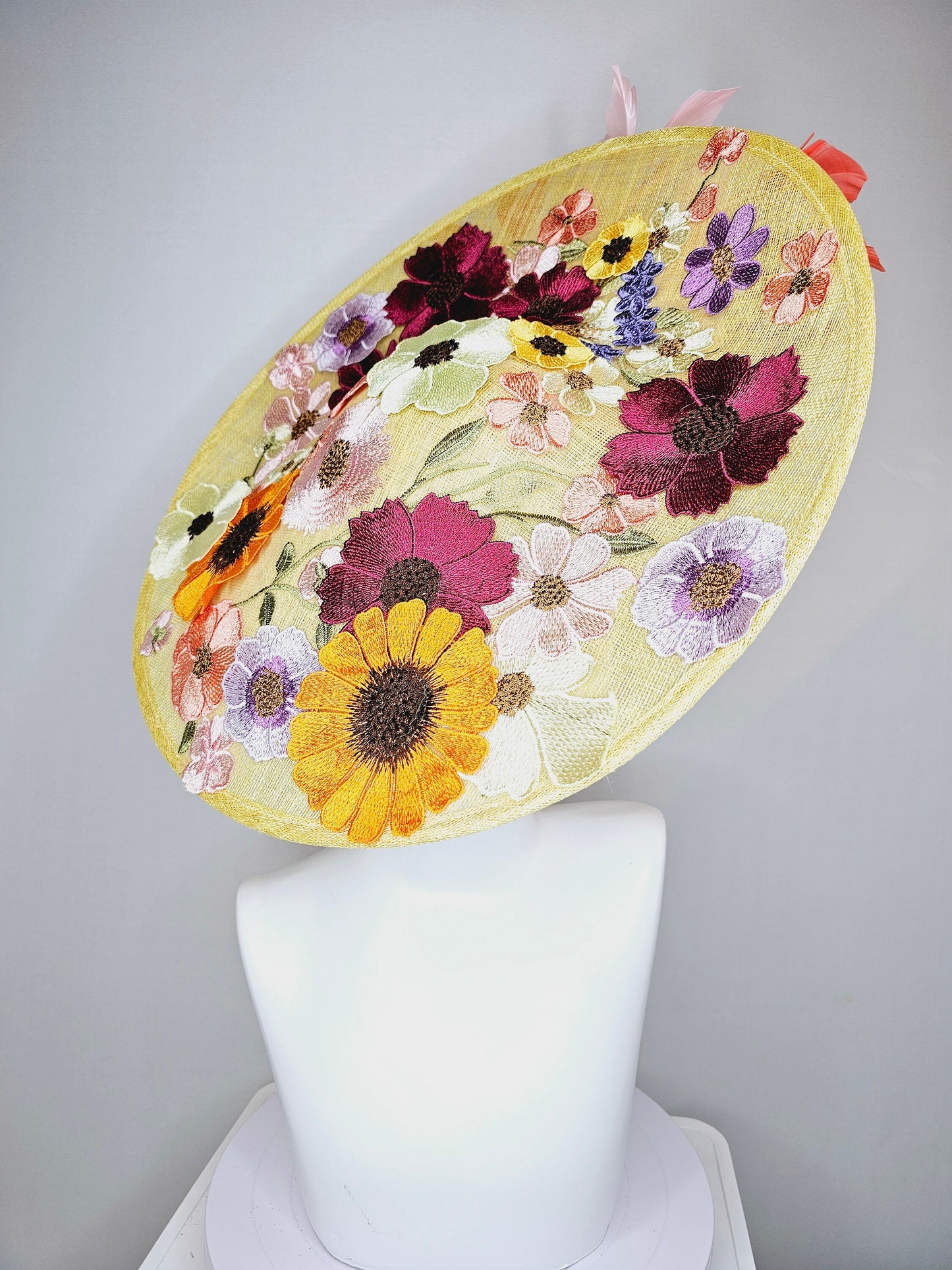 kentucky derby hat fascinator large yellow saucer sinamay rainbow red orange green pink embroidered flowers  pink coral branching feathers